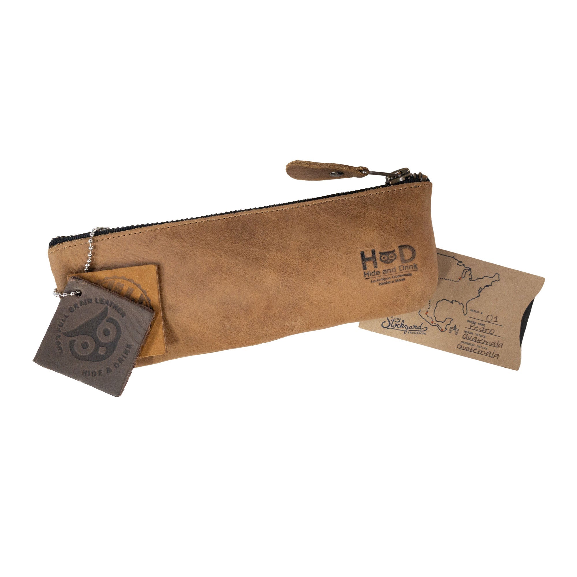 Pencil Pouch by Hide & Drink featuring branding tag and a rustic finish. This rectangular pencil case made of full grain leather is a perfect pen and marker pouch for men and women. Handcrafted in La Antigua Guatemala, it embodies a classic style suitable for artists.
