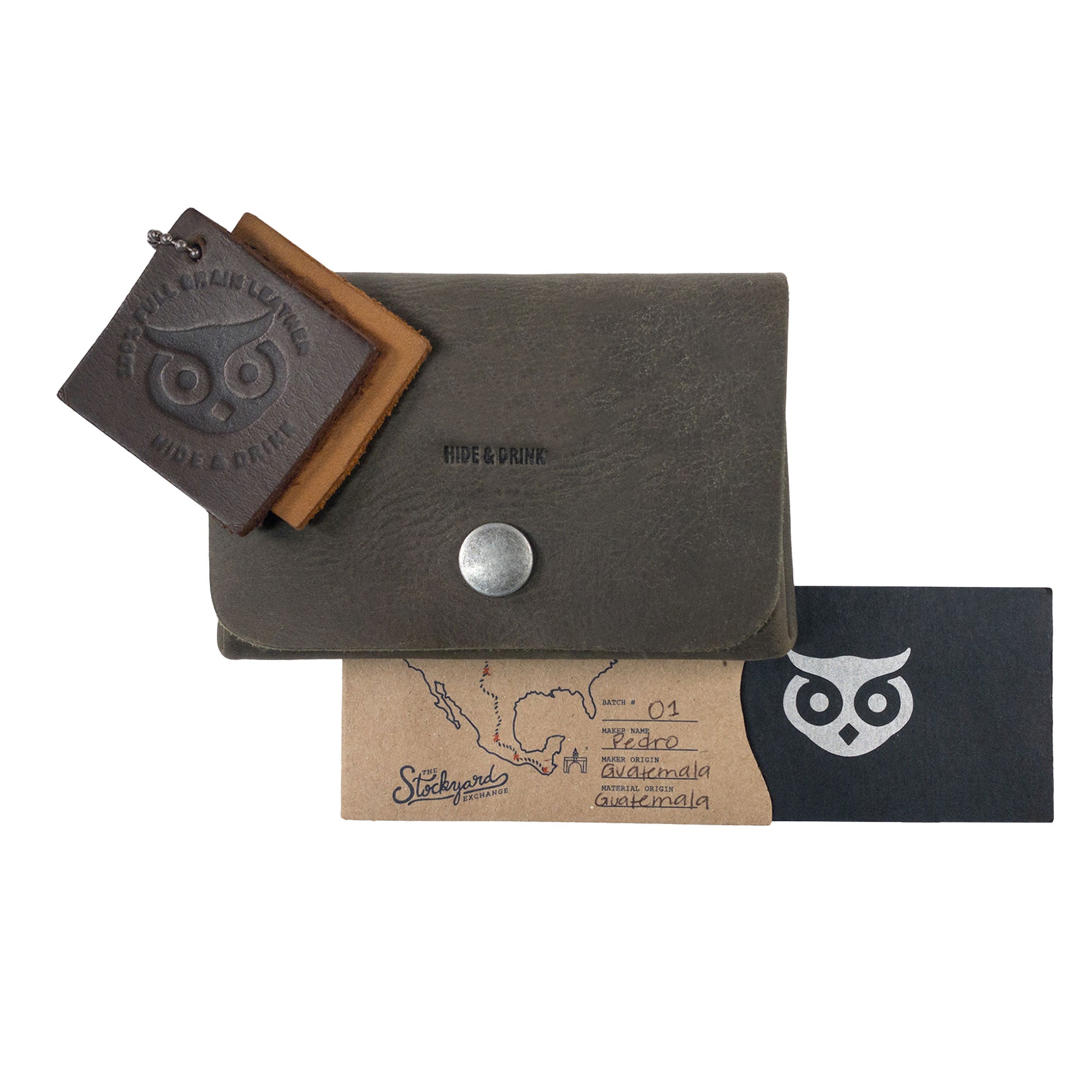 Content of the olive Double Pouch Card Wallet by Hide & Drink displayed with other leather products. This versatile Leather Double Pouch Card Wallet functions as a card organizer, cash holder, and ID case for both men and women, crafted from Full Grain Leather in La Antigua Guatemala & Oaxaca Mexico.