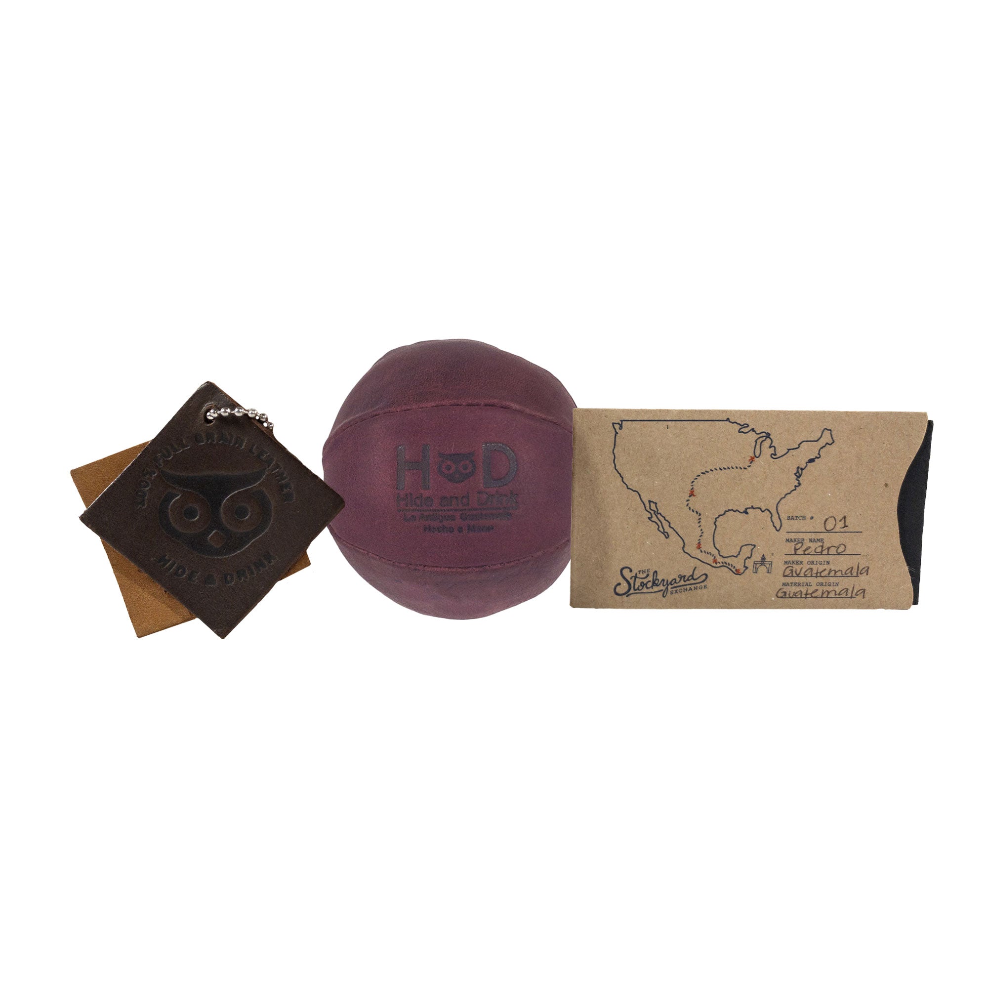 Hide & Drink maroon Stress Ball with packaging, highlighting its gift potential. This squishy tension accessory is perfect for alleviating fidgeting and anxiety, artisan crafted in La Antigua Guatemala.