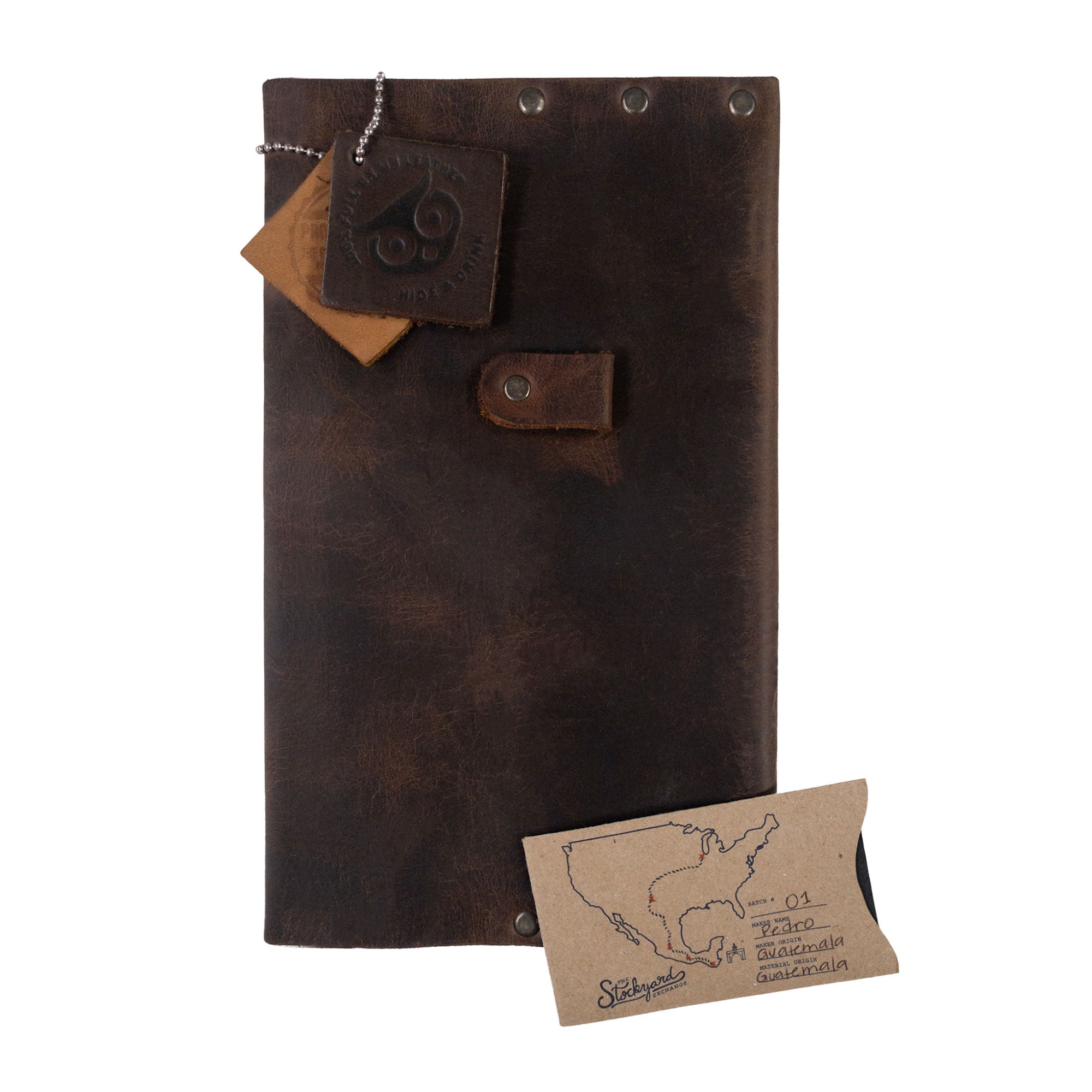 The Riveted Journal Cover (5 x 8.50 in.) from Hide & Drink offers a stylish and functional way to protect your notebook. Crafted from full grain leather, this cover is hand cut and hand sewn, reflecting the vintage style and artisan quality of handmade goods in La Antigua Guatemala. Ideal for anyone seeking a riveted journal cover for notebook (5 x 8.50 in.) (Notebook Not Included), combining classic elements with modern needs.