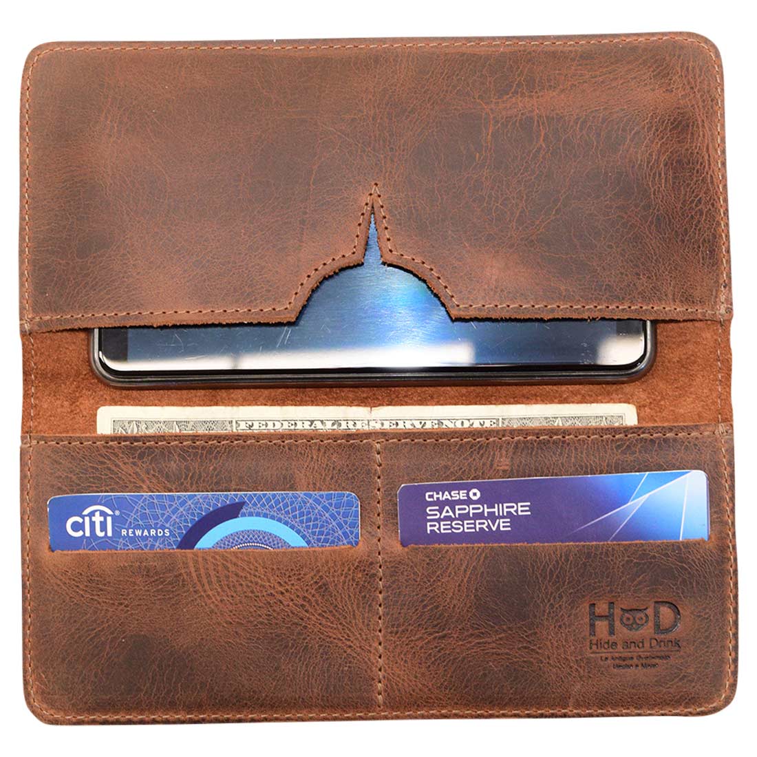 Interior view of bifold wallet for cellphone by Hide & Drink, designed with slots for cards and a compartment for cash. This Bifold Wallet for Cellphone combines functionality and elegance, featuring Full Grain Leather and unique small batch production techniques. Handmade in La Antigua Guatemala & Oaxaca Mexico, it’s an artisan piece you’ll love.
