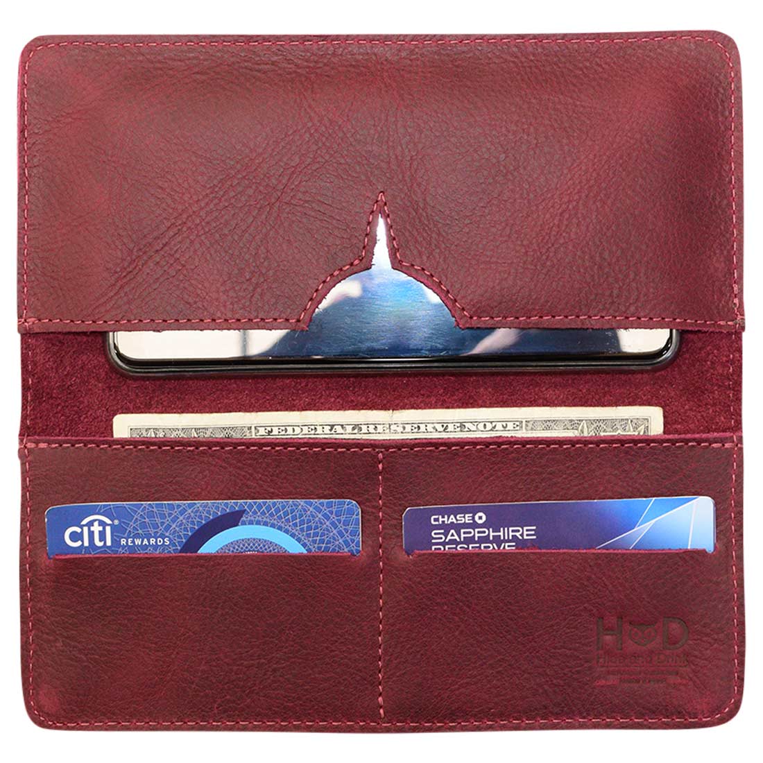 Interior view of red bifold wallet for cellphone by Hide & Drink, showing compartments for cards and a phone slot. This Bifold Wallet for Cellphone exemplifies quality with its Full Grain Leather craftsmanship. Discover the artisan details and small batch production techniques in this handmade piece from La Antigua Guatemala & Oaxaca Mexico.