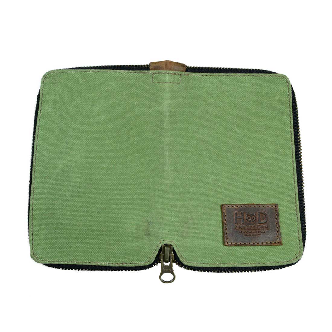 Inside view of the Waxed Canvas Zippered Journal Cover for Moleskine (Notebook NOT Included) by Hide & Drink, with a soft green Canvas finish, ideal for notes. Perfect as a Cahier Case and made from Full Grain Leather in La Antigua Guatemala & Oaxaca Mexico.