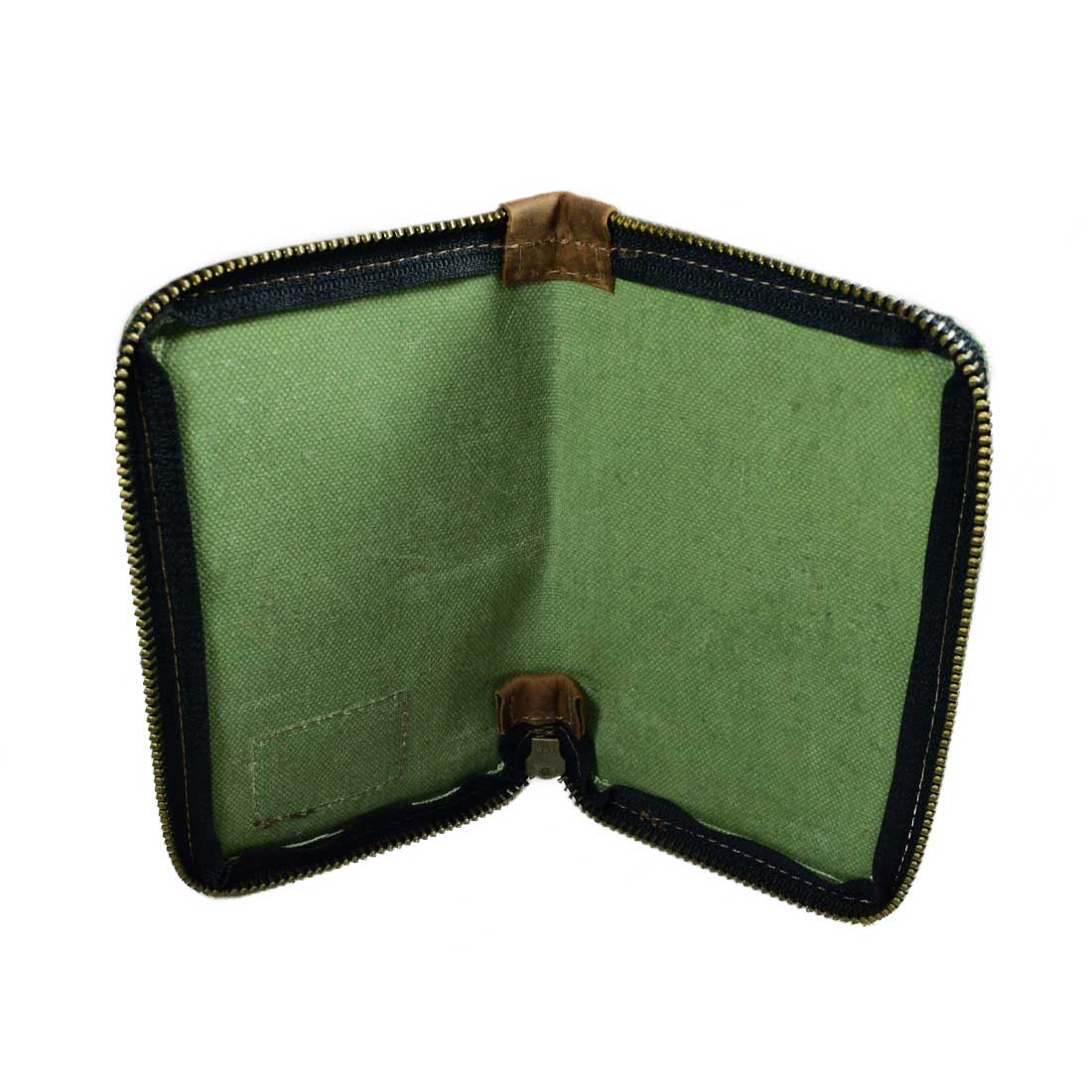 Detailed view of the Waxed Canvas Zippered Journal Cover for Moleskine (Notebook NOT Included) by Hide & Drink, showcasing the high-quality green Canvas and Leather finish. A perfect Cahier Case handcrafted by artisans in La Antigua Guatemala & Oaxaca Mexico.