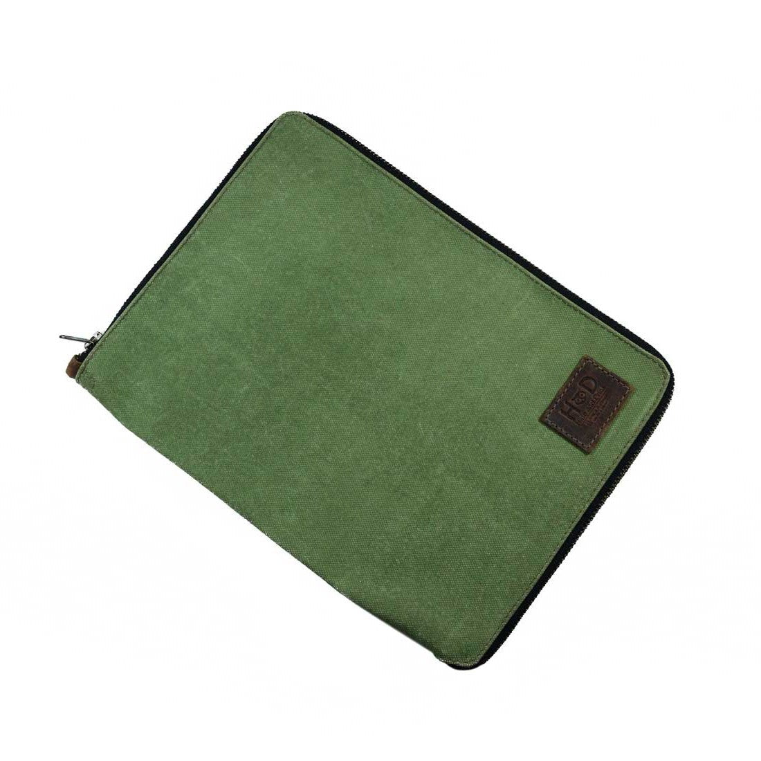 Front view of the Waxed Canvas Zippered Journal Cover for Moleskine (Notebook NOT Included) by Hide & Drink, highlighting green Canvas and luxurious Full Grain Leather detail. Perfect for Cahier Cases, showcasing artisan quality from La Antigua Guatemala & Oaxaca Mexico.