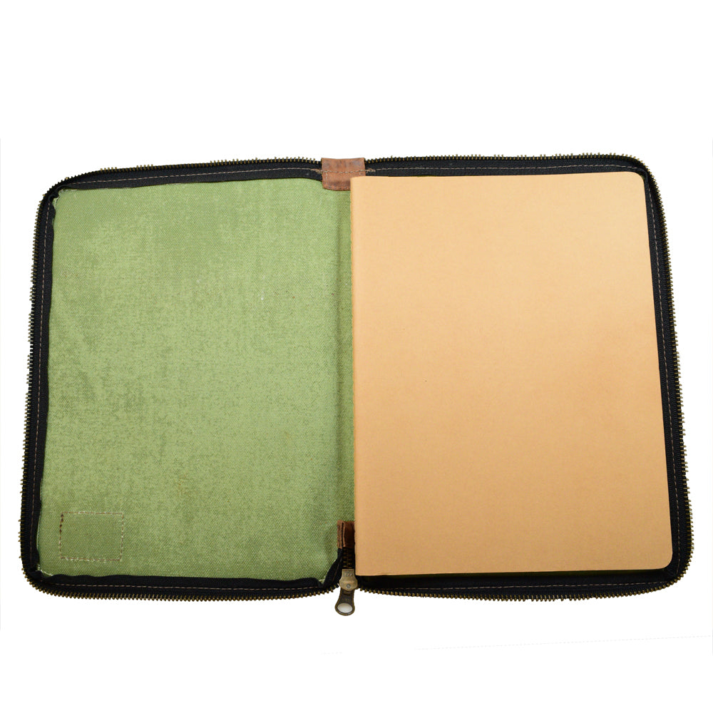 Inside view of the Waxed Canvas Zippered Journal Cover for Moleskine (Notebook NOT Included) by Hide & Drink, with an aesthetic blend of green Canvas and a sturdy construction, ideal for Cahier Case lovers. Entirely artisan-made in La Antigua Guatemala & Oaxaca Mexico using Full Grain Leather.