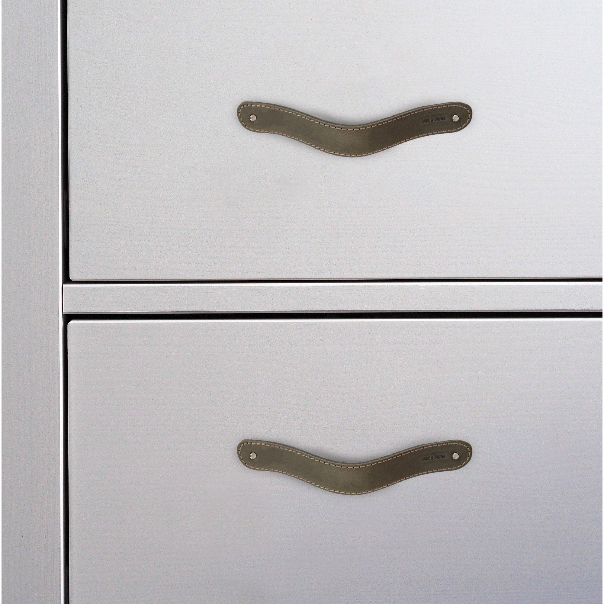 Hide & Drink Drawer Handles (4pk) showcasing a close-up of unique leather colors, highlighting the quality and craftsmanship in each handle. Artisan crafted for easy installation.