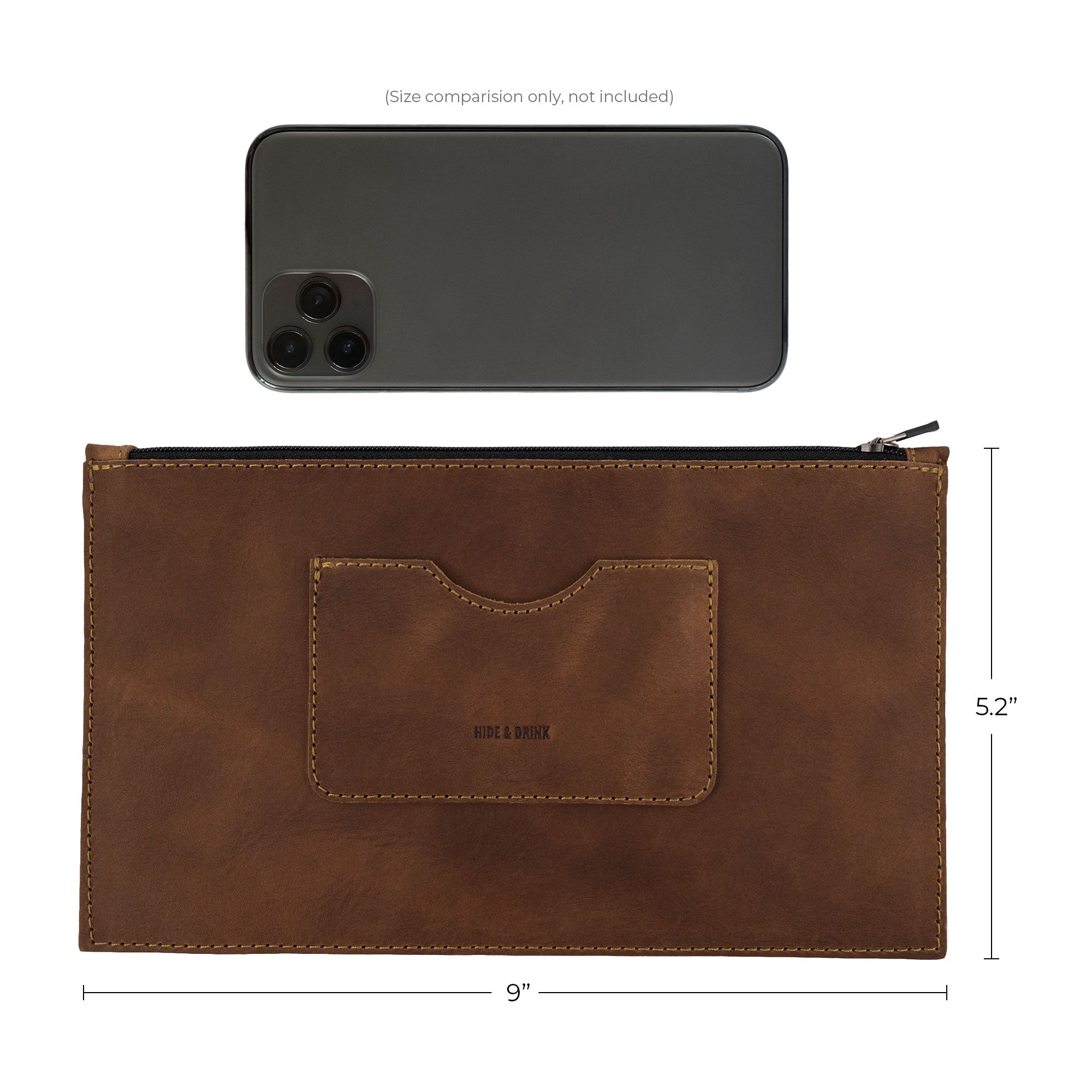 Size comparison of a brown rectangular zippered handbag by Hide & Drink next to an iPhone, illustrating its dimensions. Designed for women, this full grain leather female purse features a card slot, emphasizing artisan crafting through small batch production, handmade in La Antigua Guatemala & Oaxaca Mexico.