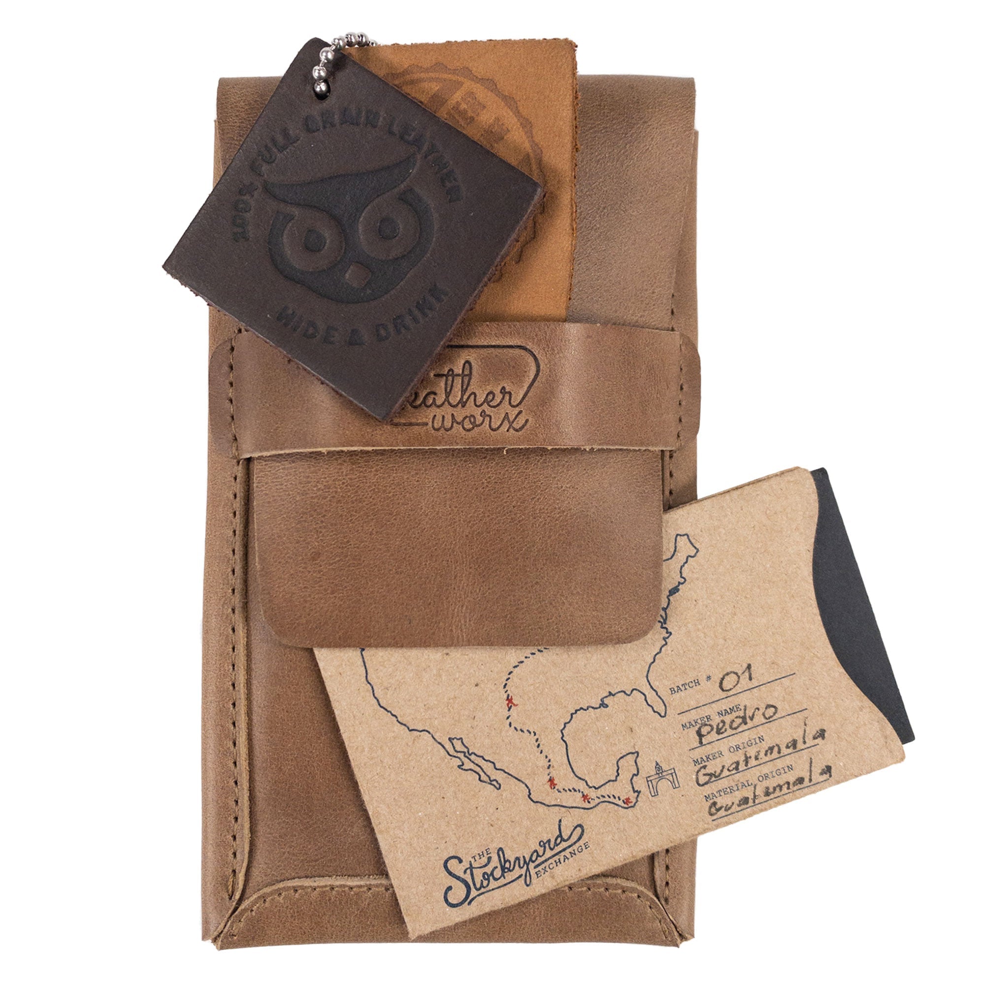 Double Pen Case from Leather Worx displayed with brand tags, demonstrating its authenticity and craftsmanship. Made from Full Grain Leather, it represents small batch production with meticulous hand cut and hand sewn features, made with care in La Antigua Guatemala & Oaxaca Mexico.