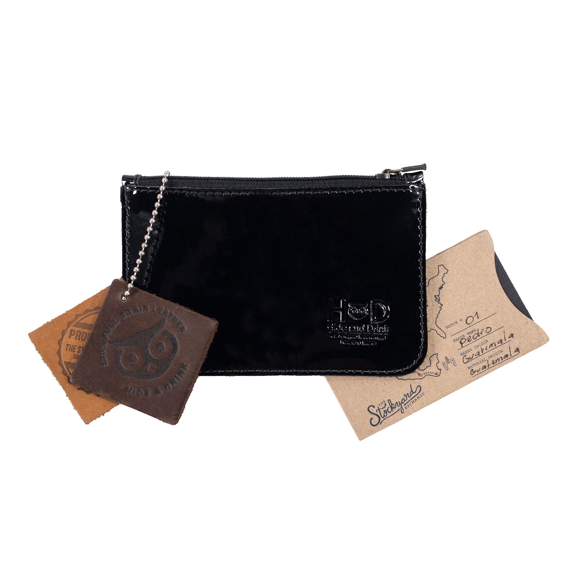 Hide & Drink Zippered Wallet alongside unique artisan creations, highlighting its value as an exquisite gift item. Made from premium full grain leather, this zippered wallet seamlessly integrates functionality as a card case and coin organizer, reflecting the craftsmanship of small batch production from La Antigua Guatemala & Oaxaca Mexico.