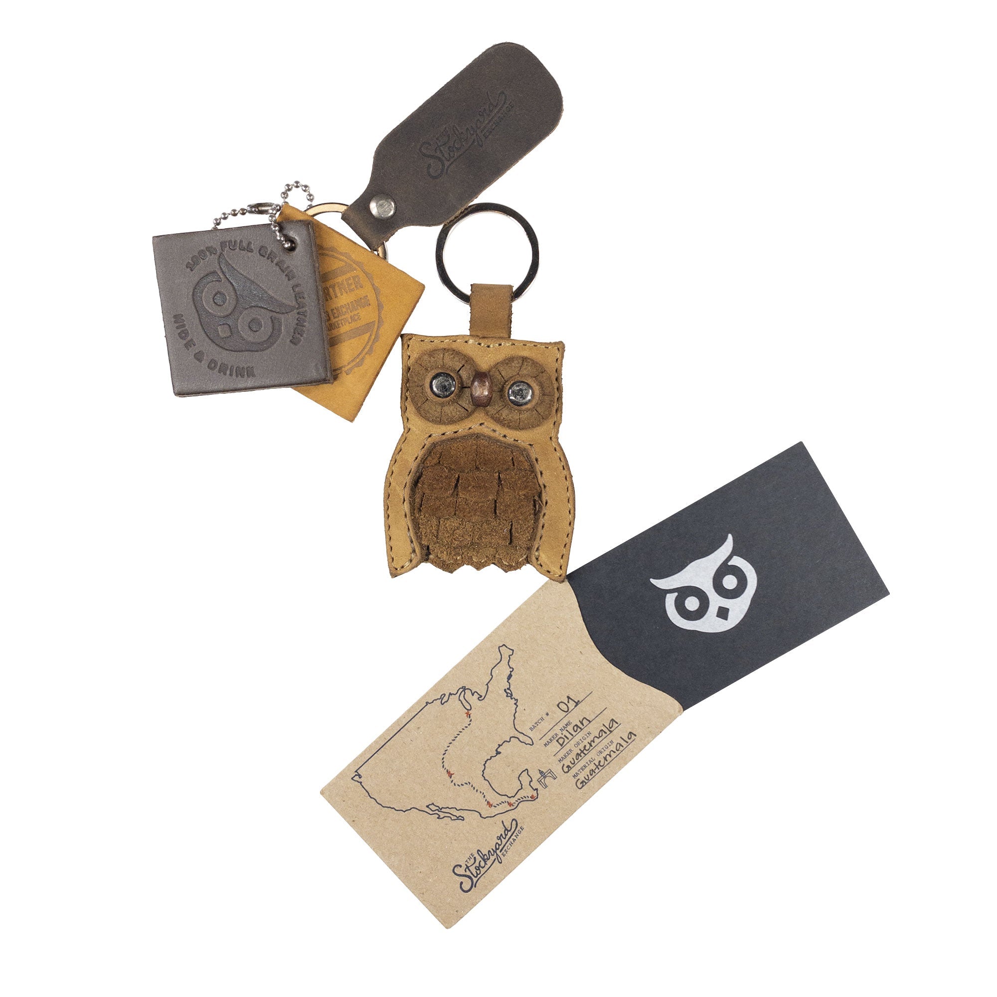 Owl-shaped Critter Key Chain by Hide & Drink, alongside its brand card, showcasing the artisan's effort. This unique Animal Key Ring Holder, crafted from Full Grain Leather, is perfect for fans of playful designs. Handmade in La Antigua Guatemala & Oaxaca Mexico.