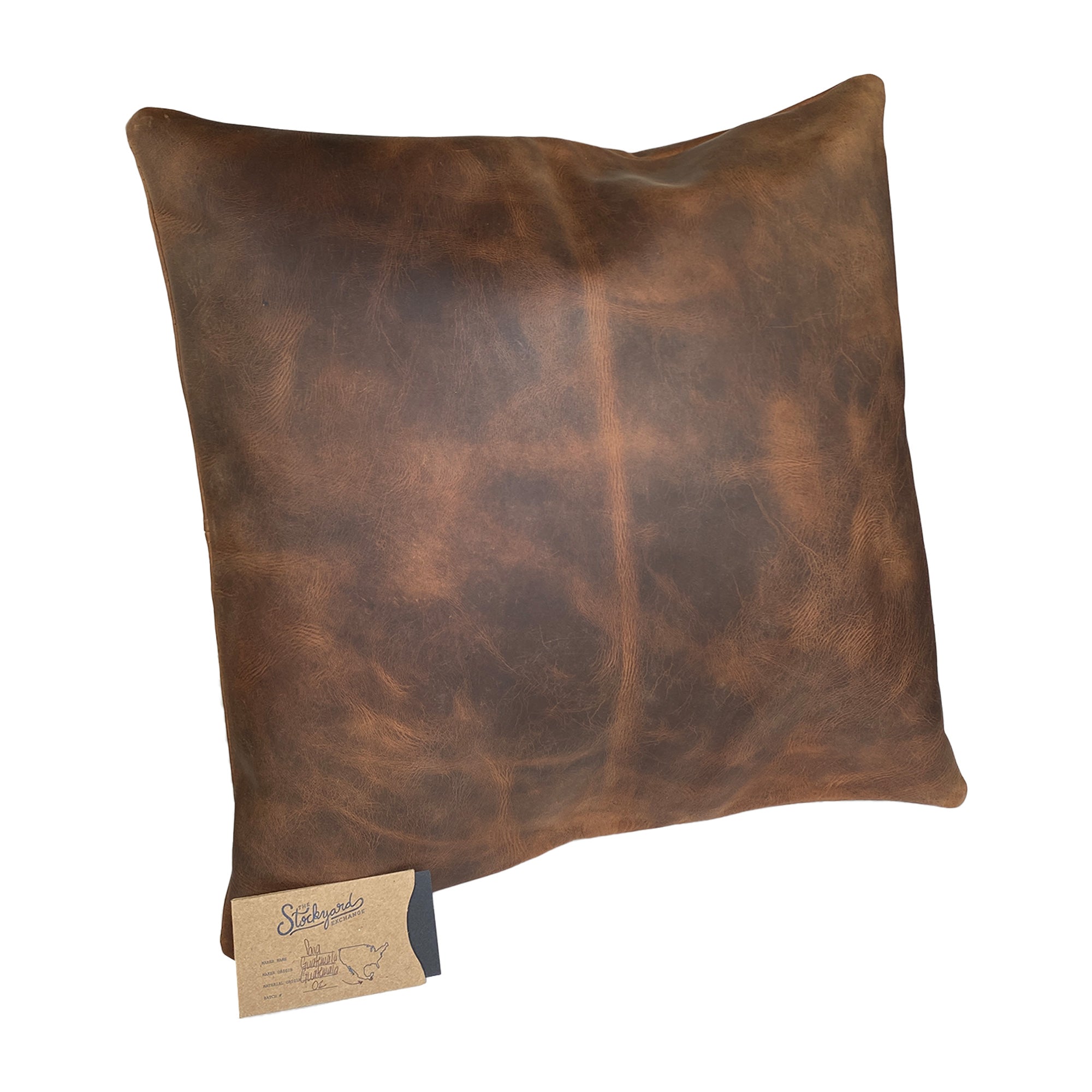 The Leather Pillow Cover 18 x 18 In. by Leather At Home is beautifully presented with a hand tag, showcasing its artisan quality and commitment to craftsmanship. Decorative Pillowcase (18 x18 inches) (Stuffing NOT Included) Wonder-Home Luxury Style, Standard Throw Cushion Covers, Full Grain Leather, StockyardX, Small Batch Production, Hand Cut, Hand Sewn, Fire Branded, Artisan, Handmade in La Antigua Guatemala & Oaxaca Mexico.
