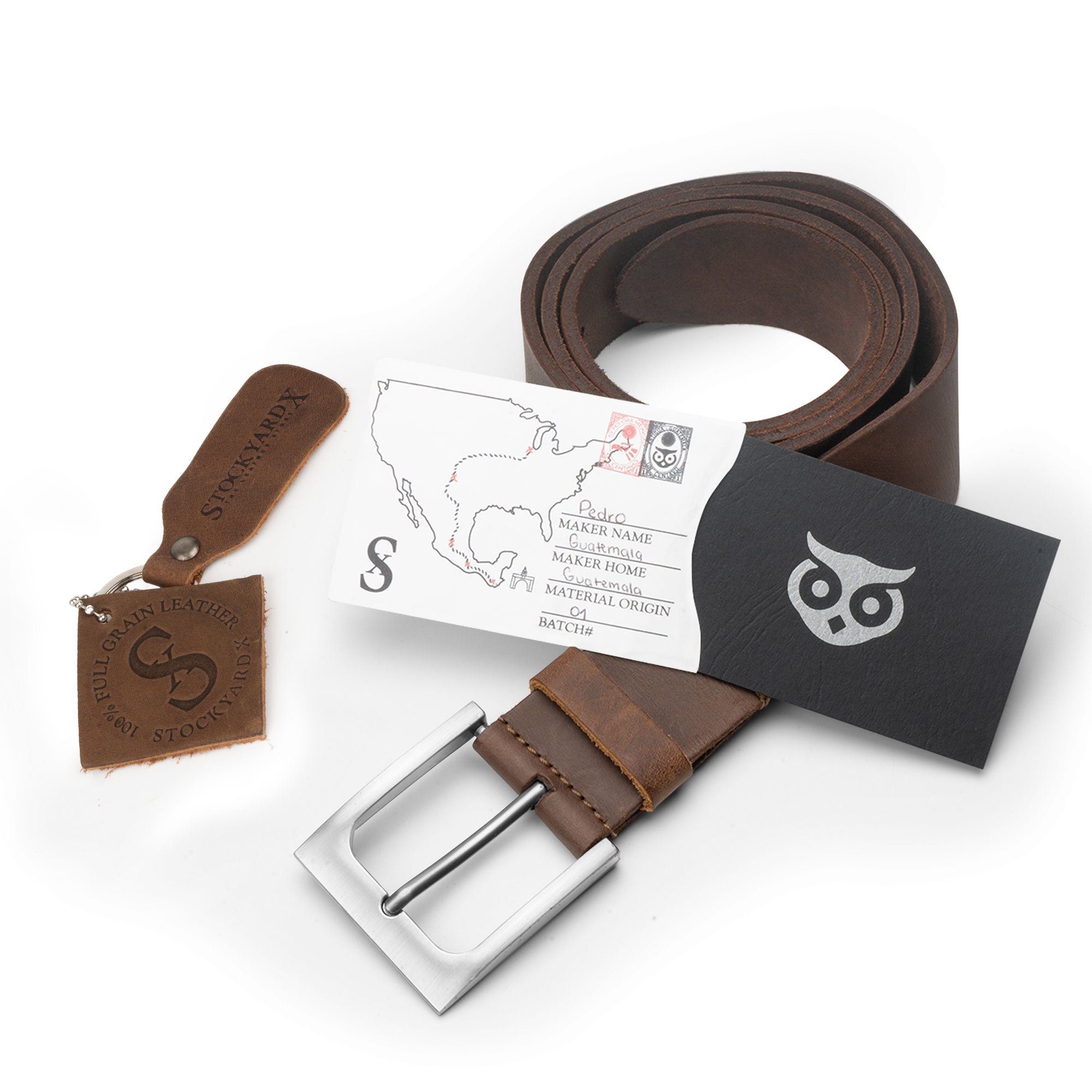 Rustic Leather Belt by Hide & Drink with a tag showcasing artisan details and materials, crafted from thick full grain leather with hand cut and hand sewn features, emphasizing small batch production made in La Antigua Guatemala.