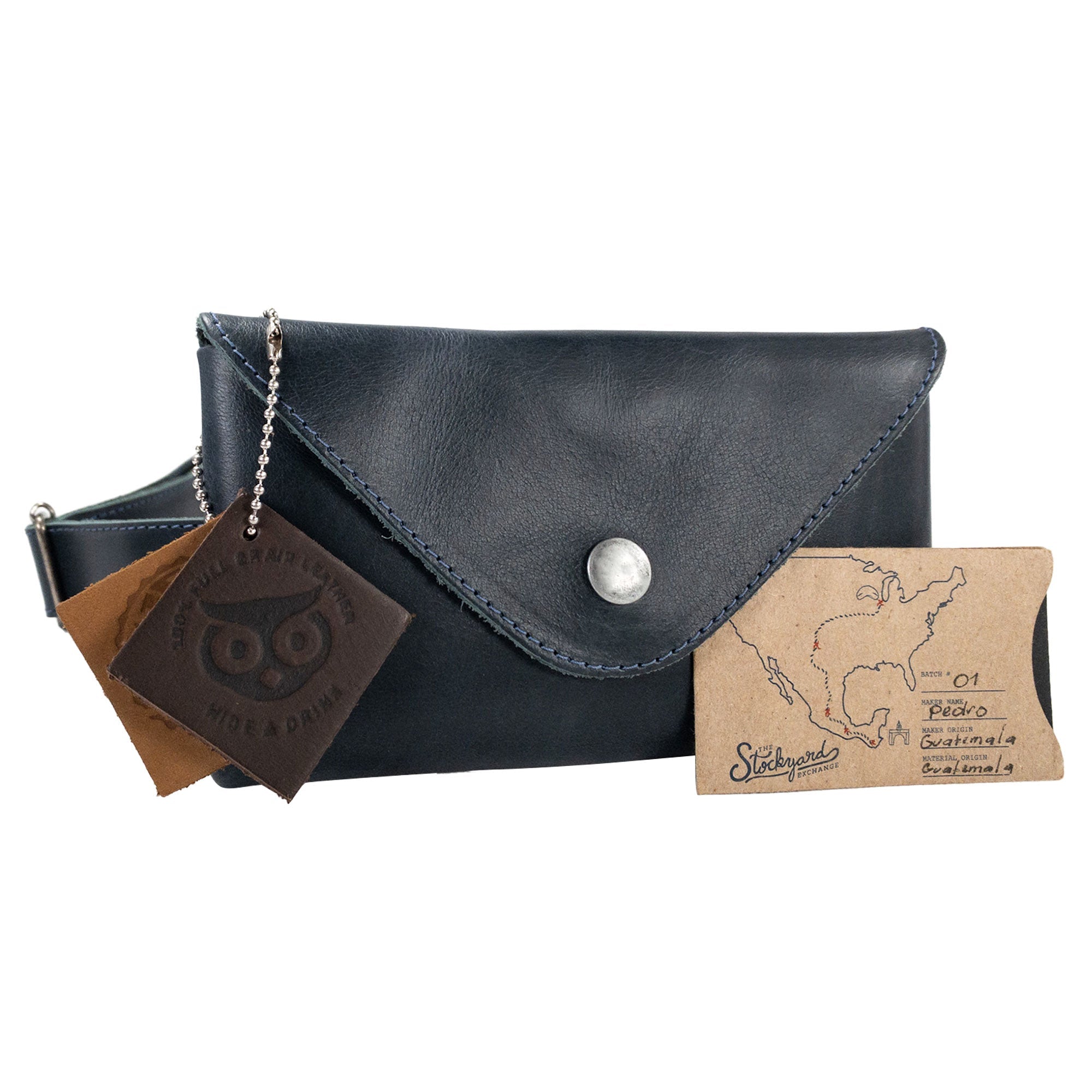 Hide & Drink's black Fancy Fanny Pack displayed with unique branding, emphasizing its artisan quality. This full grain leather waist pouch blends functionality with vintage style.
