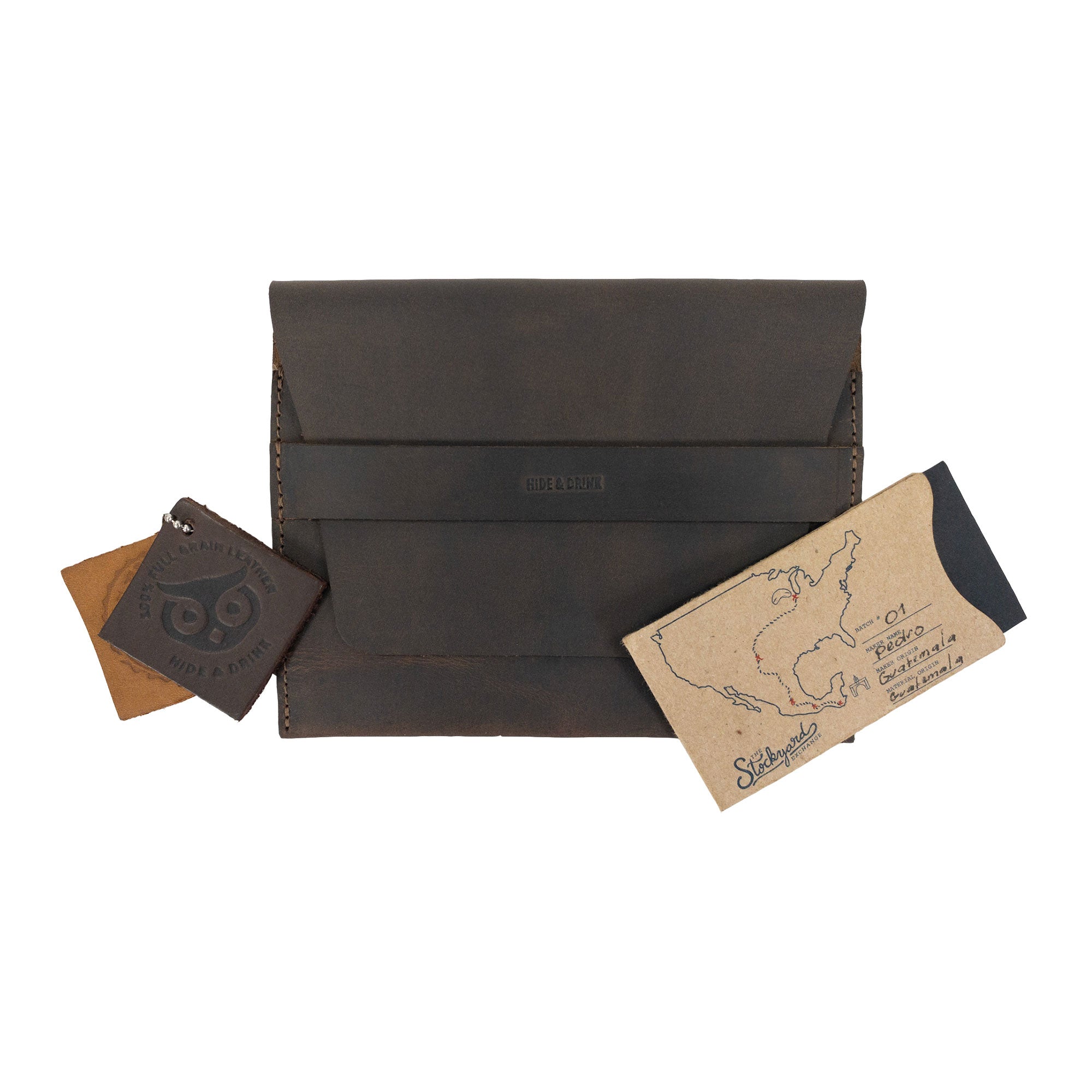 The Hide & Drink Double Watch Case set displayed with unique branded elements. This rustic bag for men exemplifies small batch production, hand cut and hand sewn, perfect for watch enthusiasts who cherish handmade products rooted in La Antigua Guatemala and Oaxaca Mexico.
