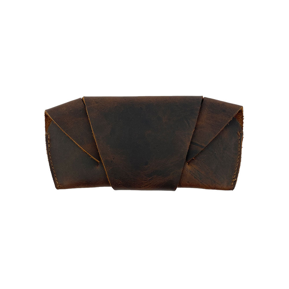 Front view of the Foldable Sunglass Case by Hide & Drink, made from Full Grain Leather, showcasing artisan craftsmanship through small batch production, hand cut and sewn, and fire branded for authenticity. Perfect for stylish protection of your sunglasses.