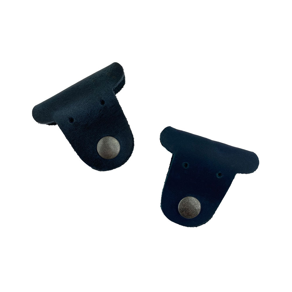 Two navy blue Dog Shaped Cord Keepers by Hide & Drink, showcasing sleek cord management with premium Full Grain Leather. Dog Shaped Cord Keeper (Cord Clam) 2-Pack, Full Grain Leather, StockyardX, Small Batch Production, Hand Cut, Hand Sewn, Fire Branded, Artisan, Handmade in La Antigua Guatemala & Oaxaca Mexico.