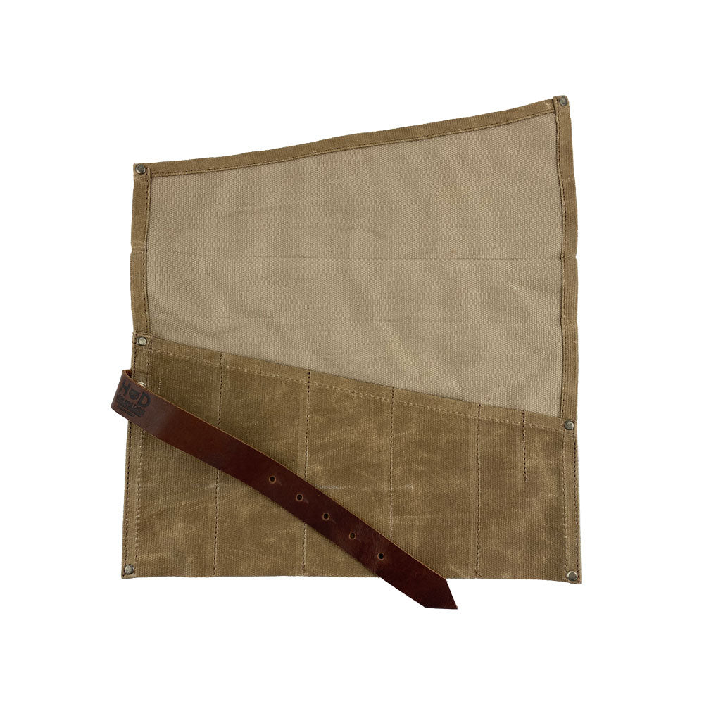 Hide & Drink's Large Tool Roll in an opened position showing its practicality. This Portable Carry-On Pouch includes 6 slots designed for effective woodworking tools organization. Constructed with waxed canvas and full grain leather variations, this artisan piece emphasizes small batch production, hand cut and hand sewn in La Antigua Guatemala & Oaxaca Mexico.