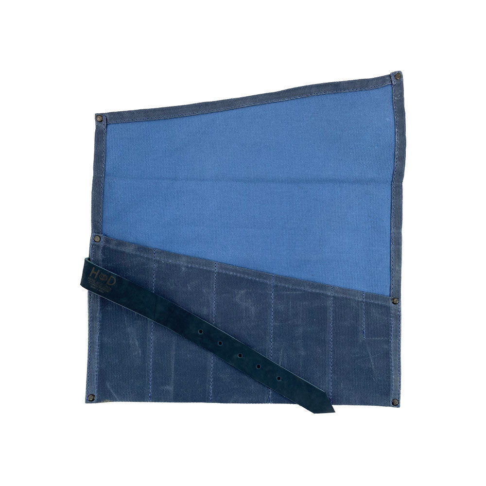 A neatly arranged Large Tool Roll from Hide & Drink showing its organization capabilities. This Portable Carry-On Pouch has 6 slots designed for woodworking tools. Crafted from waxed canvas and full grain leather variations, this artisan item emphasizes small batch production, hand cut and hand sewn in La Antigua Guatemala & Oaxaca Mexico.