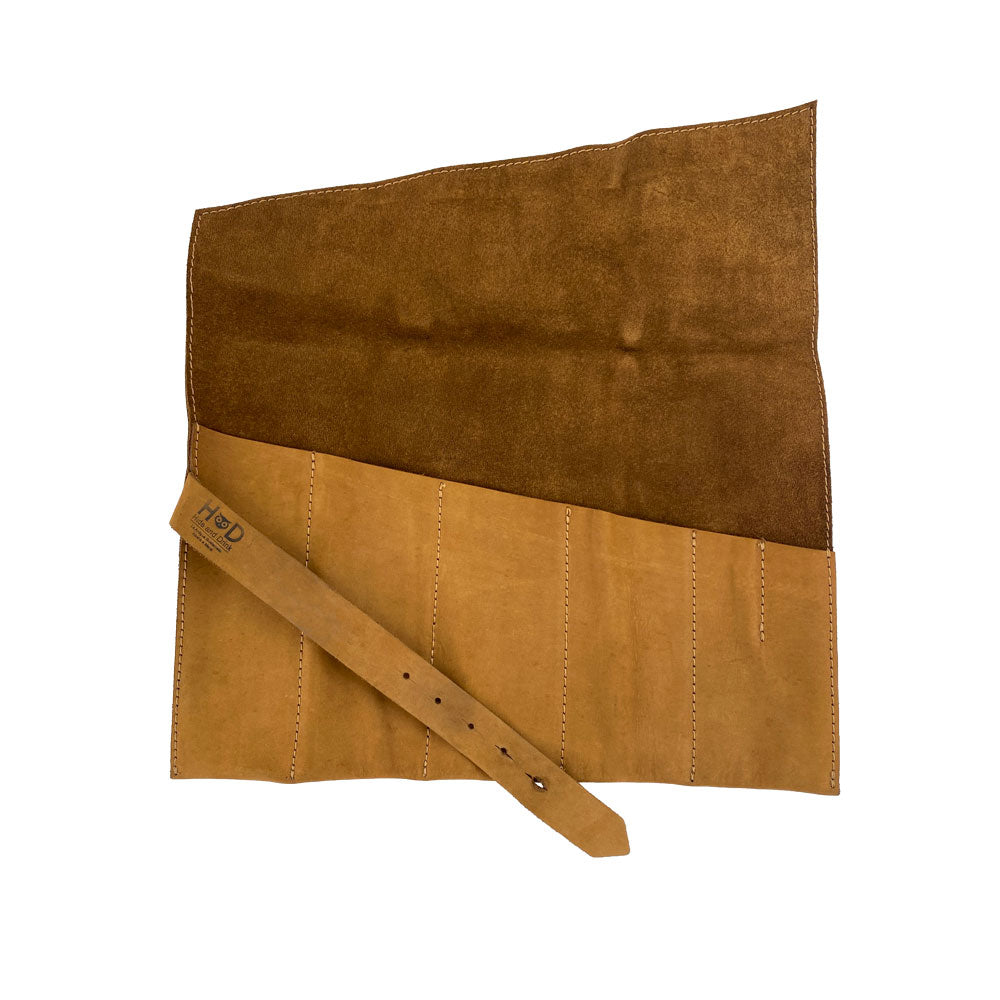 A Large Tool Roll by Hide & Drink demonstrating utility and style. This Portable Carry-On Pouch features 6 slots perfect for woodworking tools organization. Enhanced with waxed canvas and full grain leather variations, this artisan product is hand cut and hand sewn, showcasing small batch production handmade in La Antigua Guatemala & Oaxaca Mexico.