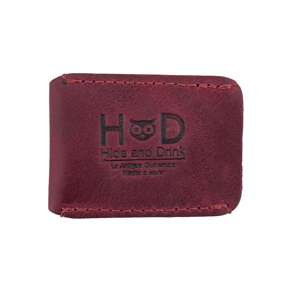 The back view of the Razor Head Cover by Hide & Drink, featuring a fire branded logo. This artisan accessory is a perfect fit for your double edge safety razor, combining style and functionality in handmade, full grain leather.