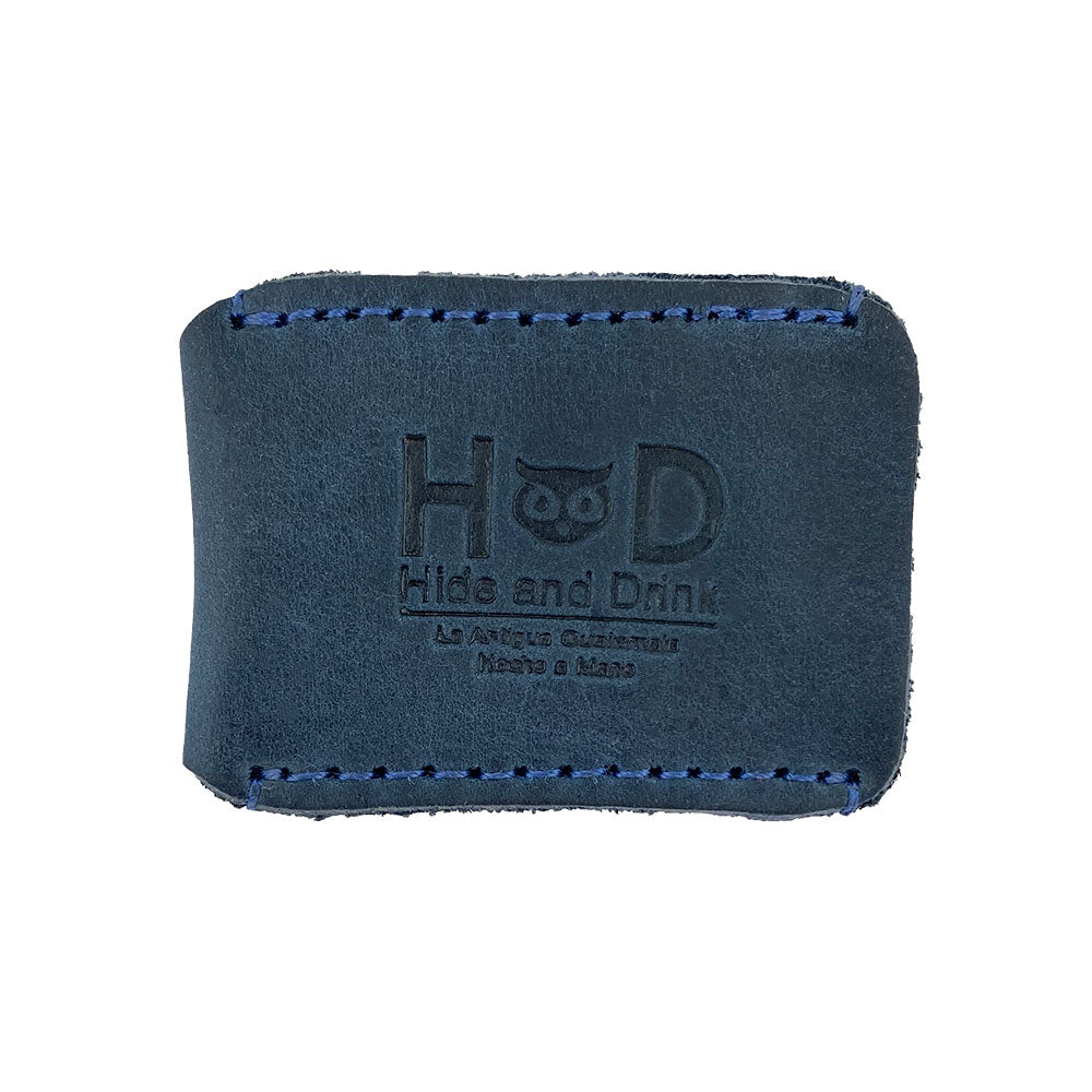 Razor Head Cover by Hide & Drink, showcasing the brand logo on a protective sheath for double edge razors. Perfect for travel, this full grain leather item emphasizes the handmade quality, with features of small batch production, hand cut, and artisan craftsmanship from La Antigua Guatemala and Oaxaca Mexico.