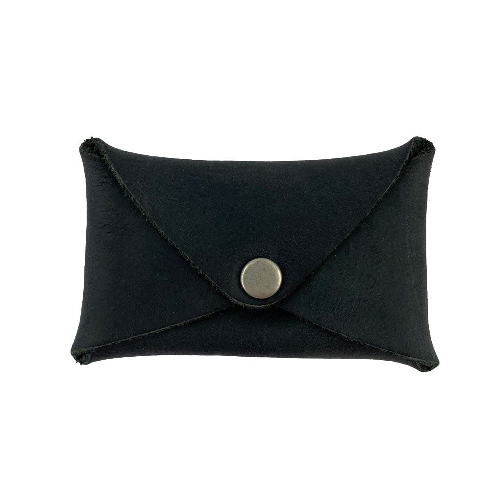 Hide & Drink Envelope Coin Case in black leather, showcasing the sleek and rustic design. This small batch production item is crafted from full grain leather, handmade in La Antigua Guatemala & Oaxaca Mexico.