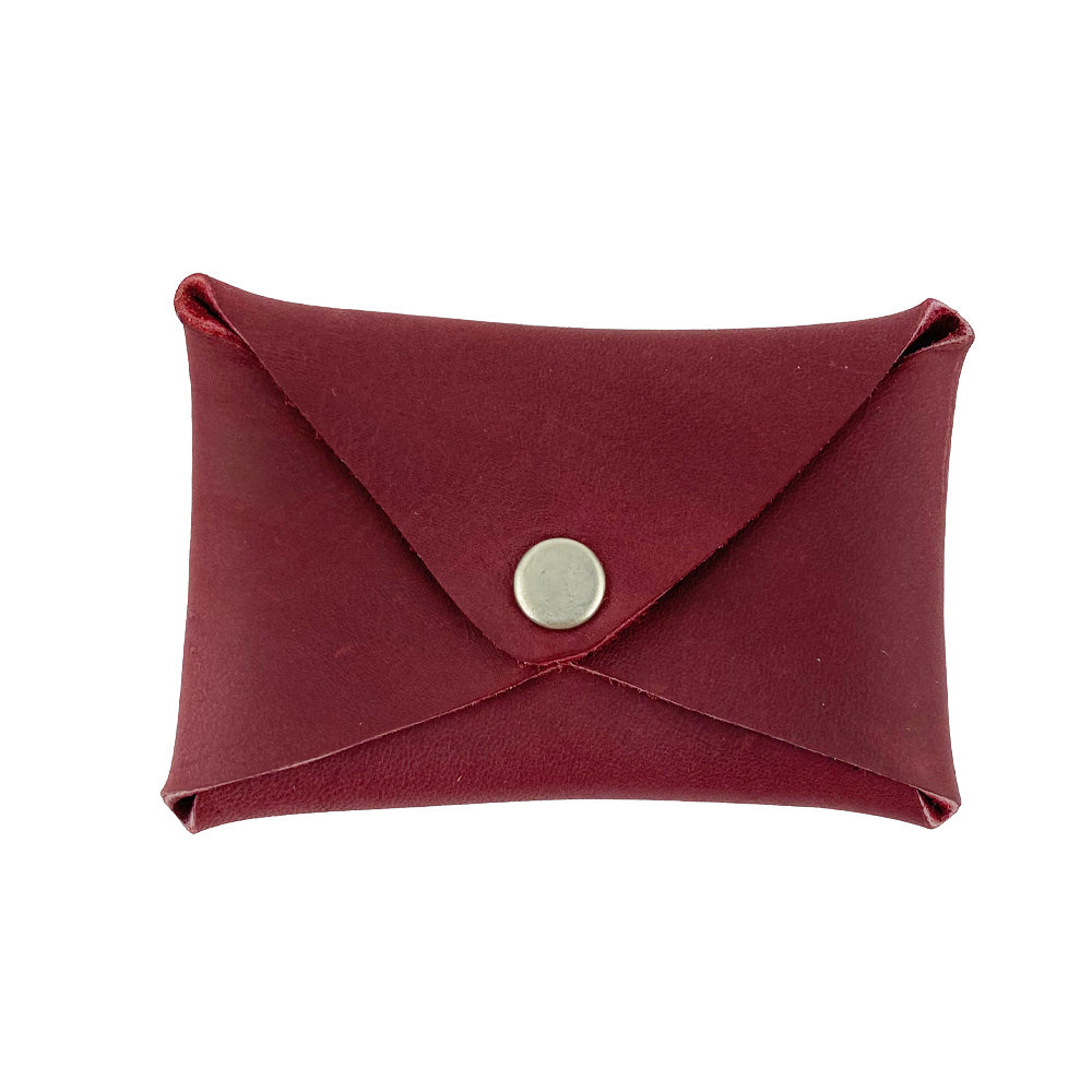 Hide & Drink Envelope Coin Case in burgundy leather, showcasing a rustic and stylish design. This artisan-crafted item is made from full grain leather, highlighting small batch production techniques in La Antigua Guatemala & Oaxaca Mexico.