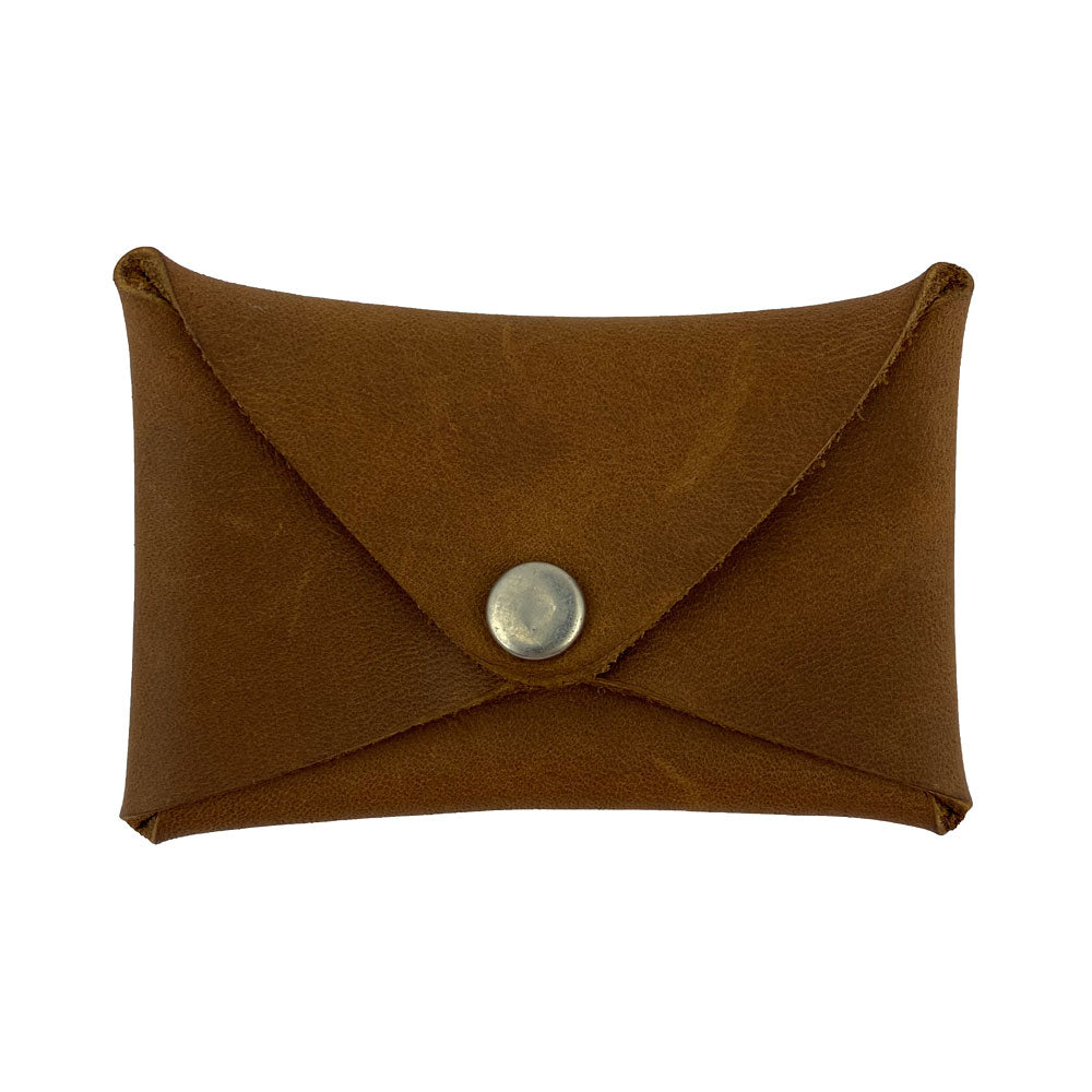 Hide & Drink Envelope Coin Case in brown leather, highlighting its rustic charm and practical design. This artisan-crafted piece is made from full grain leather and is handmade in La Antigua Guatemala & Oaxaca Mexico.