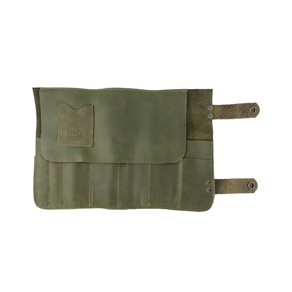 Hide & Drink's Barber Tool Roll showcases a Snap Tool Roll Up Bag with 14 Slots perfect for organization of scissors & screwdrivers. Made from durable Full Grain Leather, this portable carry case reflects StockyardX's commitment to small batch production and artisan craftsmanship, hand cut, hand sewn, and fire branded in La Antigua Guatemala & Oaxaca Mexico.