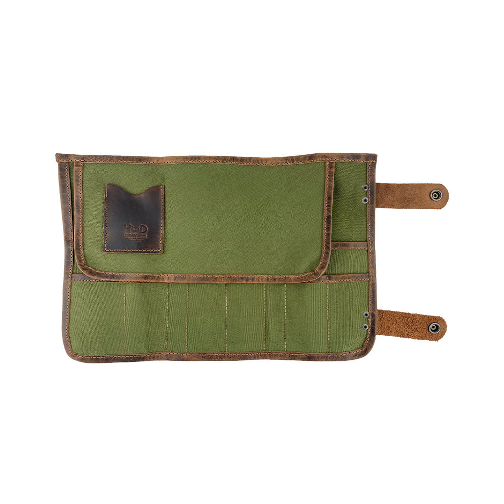 Hide & Drink's Barber Tool Roll presents a Snap Tool Roll Up Bag with 14 Slots, ideal for scissors & screwdrivers. This portable carry case, made from Full Grain Leather, showcases StockyardX's dedication to small batch production and artisan craftsmanship, hand cut, hand sewn, and fire branded in La Antigua Guatemala & Oaxaca Mexico.