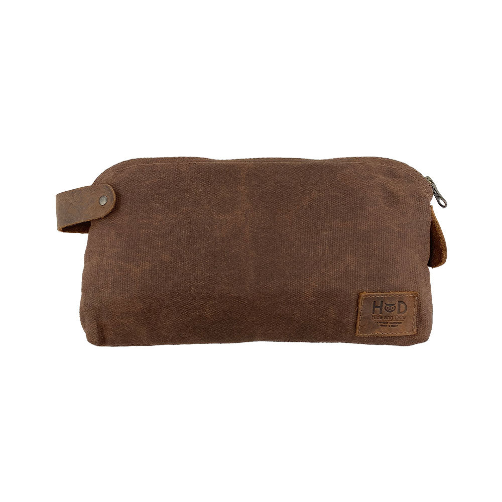 Dopp Kit Utility Bag by Hide & Drink showcasing a visually captivating design with multi-purpose functionality. This artisan Dopp Kit Utility Bag is perfect for cords and chargers, crafted from high-quality full grain leather with emphasis on hand cut and hand sewn craftsmanship, handmade in La Antigua Guatemala & Oaxaca Mexico.