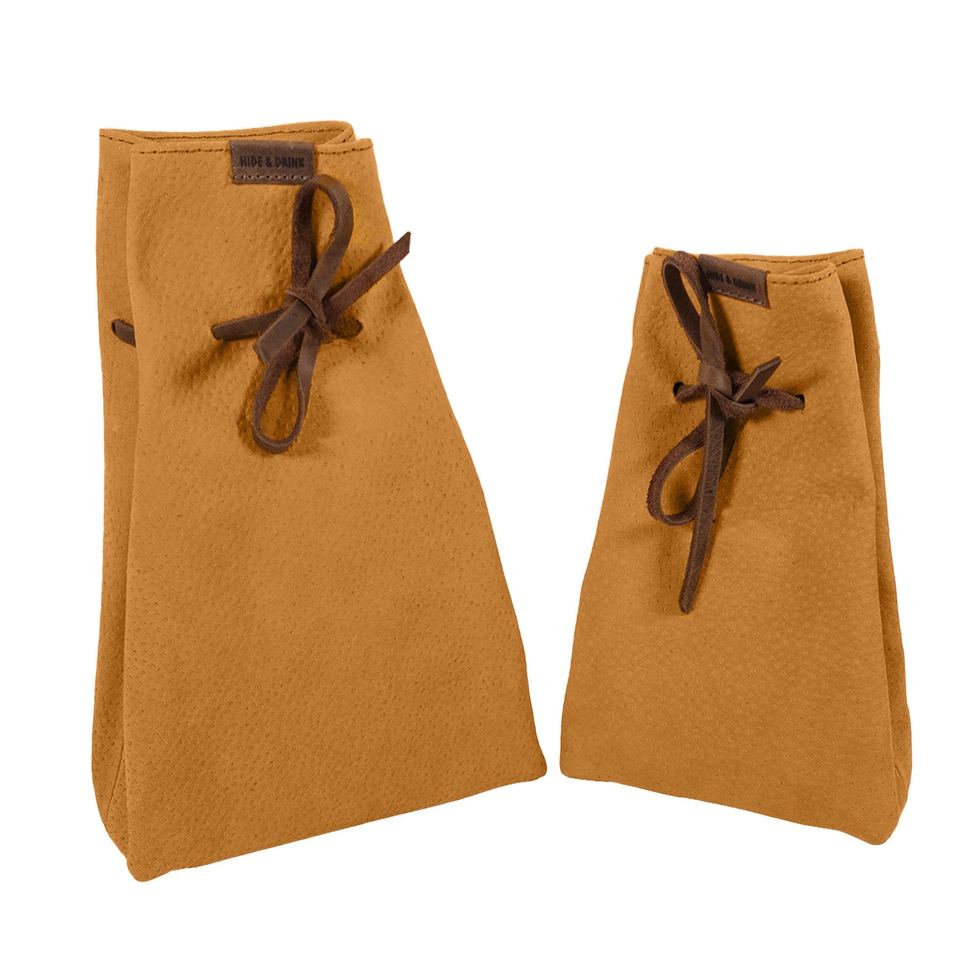 Showcasing a unique hue of Hide & Drink's Drawstring Sack (2 pack) made from exquisite sheepskin leather, highlighting its versatility. Drawstring Sack (2 pack) Handmade from Sheepskin and Full Grain Leather, StockyardX, Small Batch Production, Hand Cut, Hand Sewn, Fire Branded, Artisan, Handmade in La Antigua Guatemala & Oaxaca Mexico.