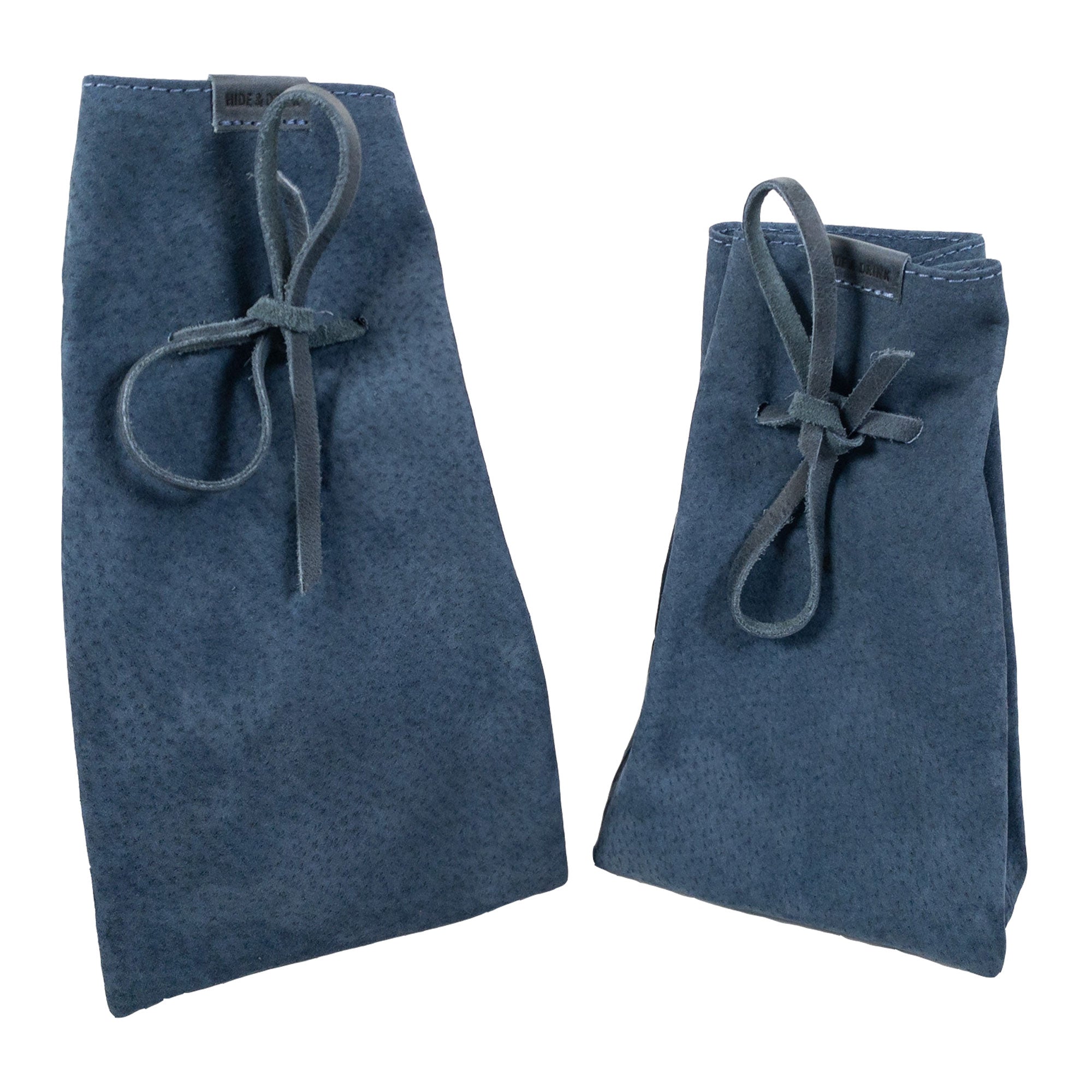 Detailed view of the richly textured leather on Hide & Drink's Drawstring Sack (2 pack), perfect for organizing items stylishly. Drawstring Sack (2 pack) Handmade from Sheepskin and Full Grain Leather, StockyardX, Small Batch Production, Hand Cut, Hand Sewn, Fire Branded, Artisan, Handmade in La Antigua Guatemala & Oaxaca Mexico.