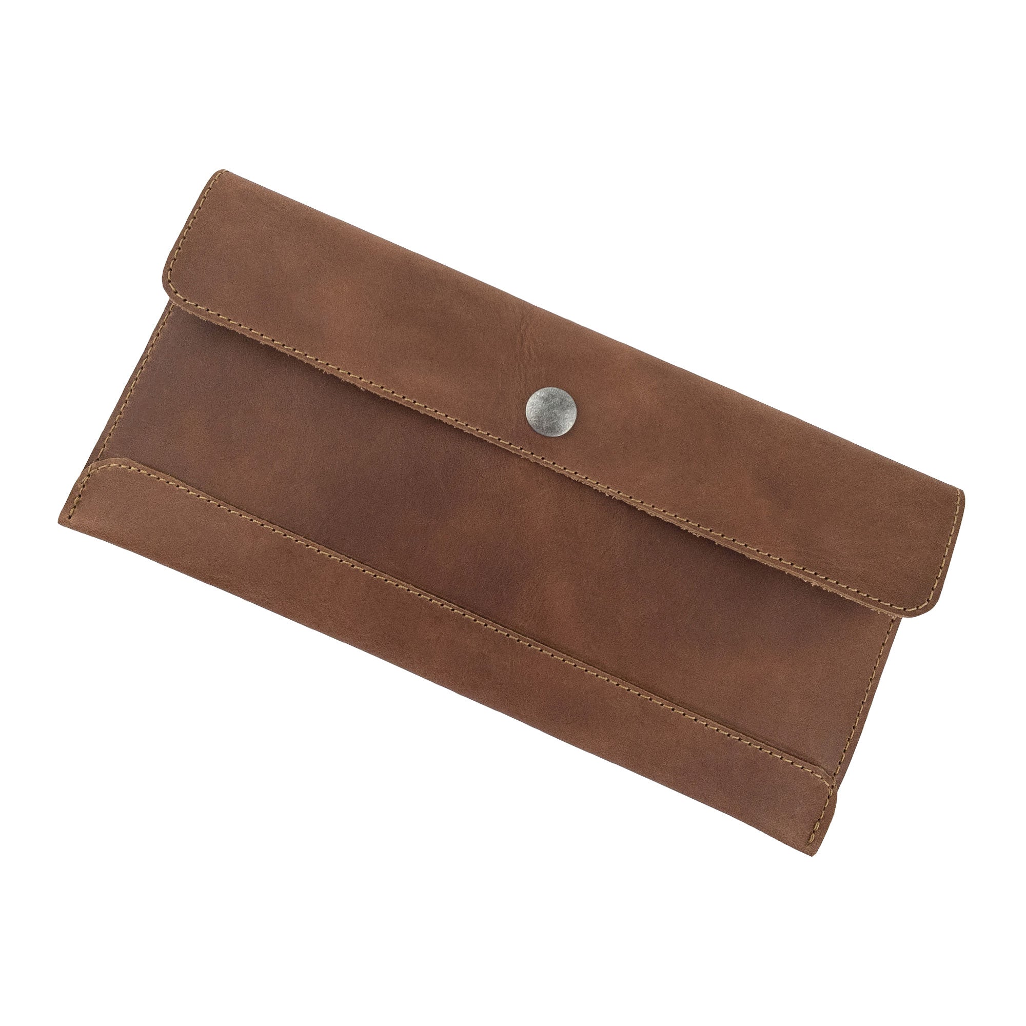 Hide & Drink's brown Travel Hand Wallet viewed from the top, made from premium Full Grain Leather. This Travel Wallet is a symbol of artisan craftsmanship, meticulously hand sewn in La Antigua Guatemala & Oaxaca Mexico.