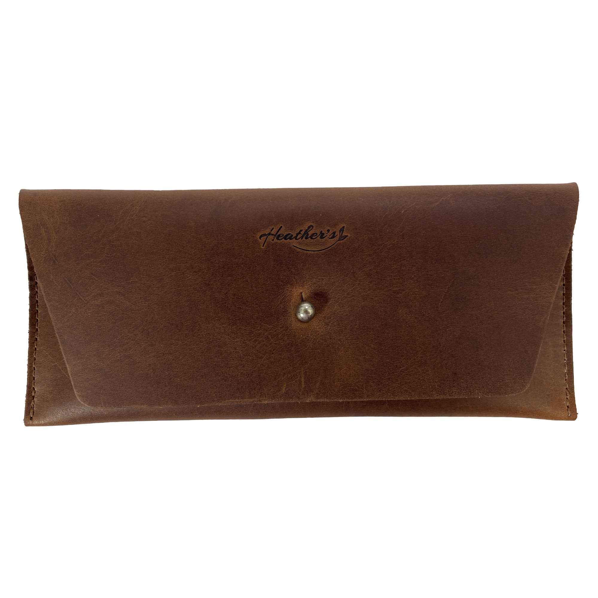 Heather's Long Utility Pouch, a stylish wallet for carrying and storing cash, coins, and cards. This vintage, minimalist style clutch is made from full grain leather, showcasing the unique craftsmanship of StockyardX with small batch production. Hand cut and hand sewn, this artisan piece is fire branded, perfect for those seeking handmade goods from La Antigua Guatemala.