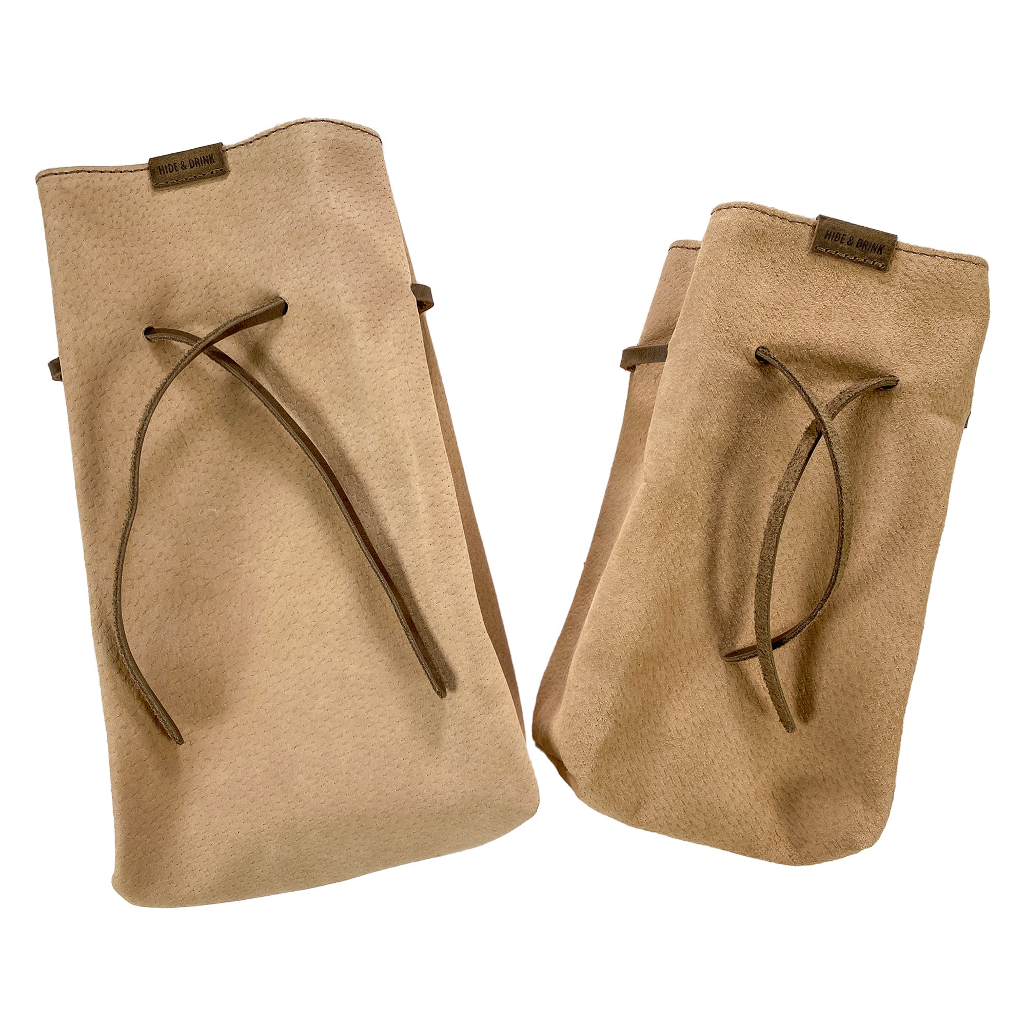 A pair of Hide & Drink's Drawstring Sack (2 pack) displayed from a different angle, highlighting its versatile design and quality materials. Drawstring Sack (2 pack) Handmade from Sheepskin and Full Grain Leather, StockyardX, Small Batch Production, Hand Cut, Hand Sewn, Fire Branded, Artisan, Handmade in La Antigua Guatemala & Oaxaca Mexico.