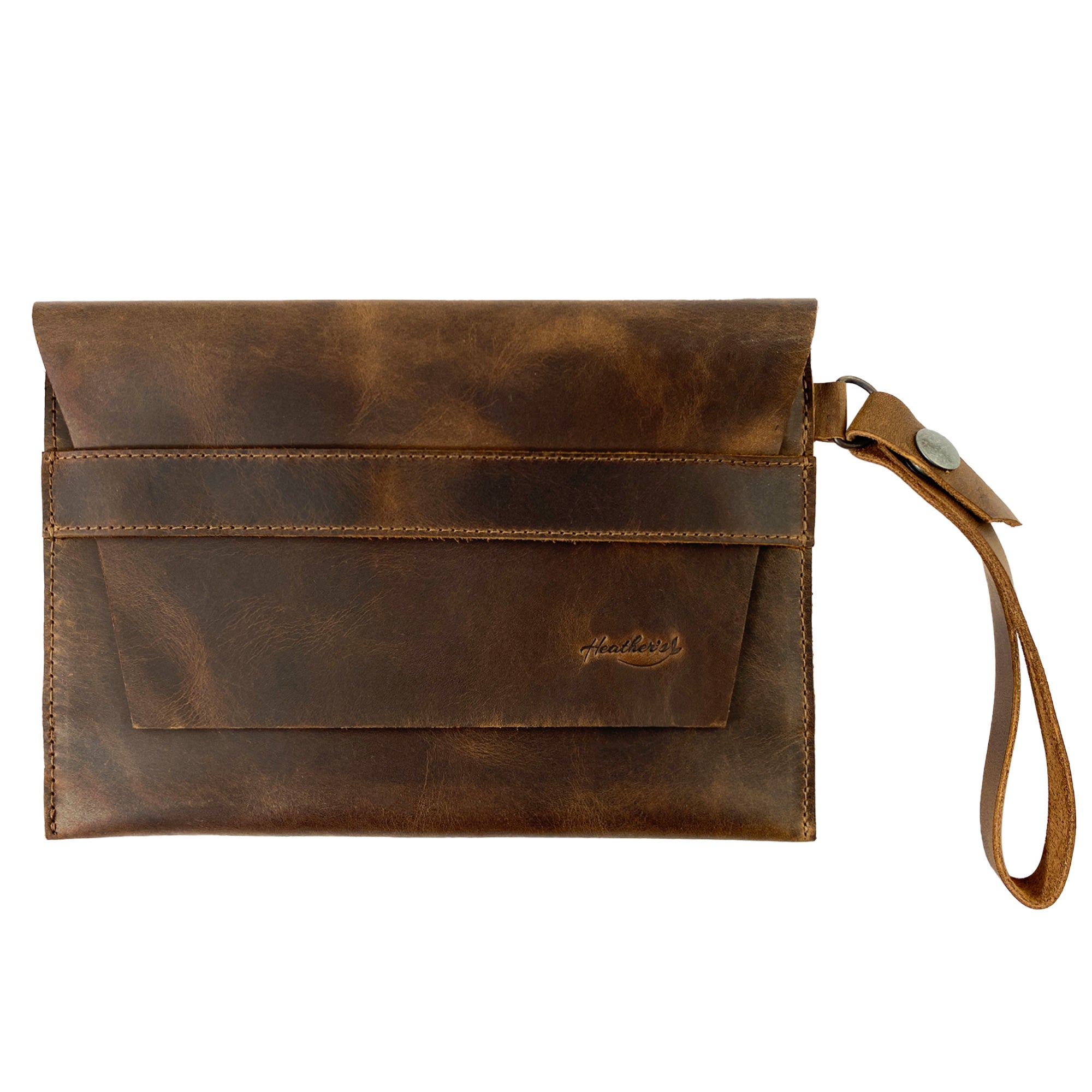 Heather's Vintage Clutch Bag features a stylish wrist wallet design, perfect for cards, money, and coins. Made from high-quality full grain leather, this artisan bag showcases small batch production techniques. Hand cut and sewn, it is fire branded and made in La Antigua Guatemala & Oaxaca Mexico.