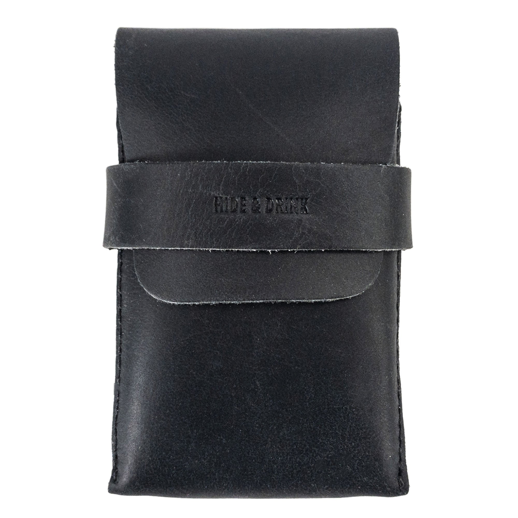 Front view of Hide & Drink's Playing Card Case in black leather. This stylish travel accessory serves as a classic case for playing cards (not included), providing secure storage for game nights. Made from full grain leather, this artisan crafted item is hand cut and sewn, reflecting StockyardX's commitment to quality.