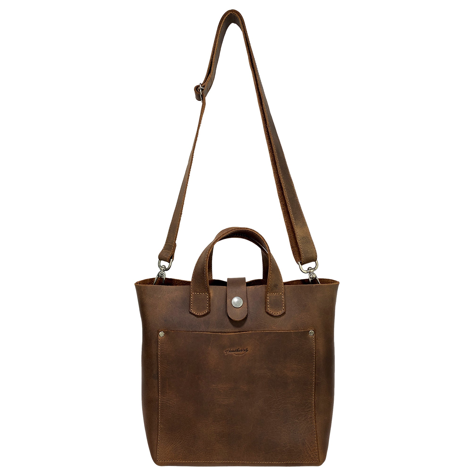 Heather's Crossbody Tote Bag with Pouch, displayed from a front angle, this classy purse is crafted from full grain leather, offering a vintage style shoulder case ideal for travel and shopping. Handmade in La Antigua Guatemala & Oaxaca Mexico, it represents artisan craftsmanship with small batch production.
