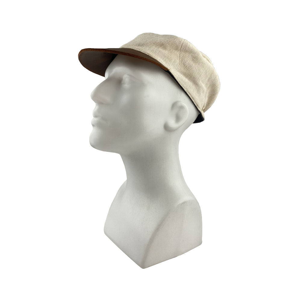 Front view of the Manta Cotton Painter Cap from Hide & Drink, highlighting its stylish profile crafted from Full Grain Leather & Natural Manta Cotton, ideal for creative souls. This Canvas Painter Cap is a product of small batch production, hand cut, hand sewn, fire branded, and reflects the artisan tradition of being handmade in La Antigua Guatemala & Oaxaca Mexico.