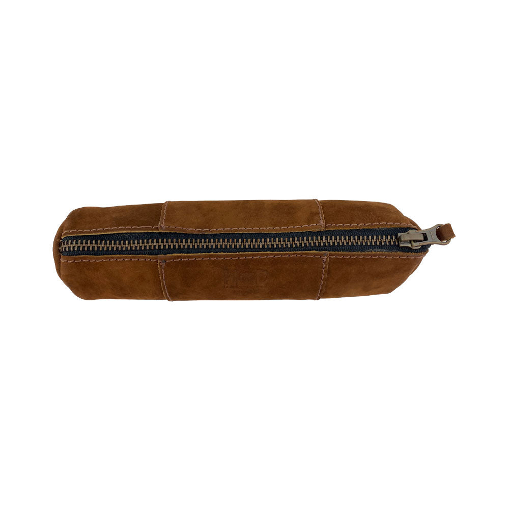 Side view of the Utility Cylinder Case by Hide & Drink highlighting the durable zipper. This elegant, handmade bag is perfect for storing personal items or office supplies, crafted from Full Grain Leather in Oaxaca Mexico. Cylinder Case, Rustic, Artisan.