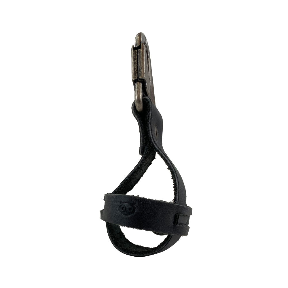 Black Golf Ball Holder by Hide & Drink displaying a unique design with a belt loop hook, crafted from rustic full grain leather. This handmade item exemplifies small batch production, expertly crafted in La Antigua Guatemala & Oaxaca Mexico.