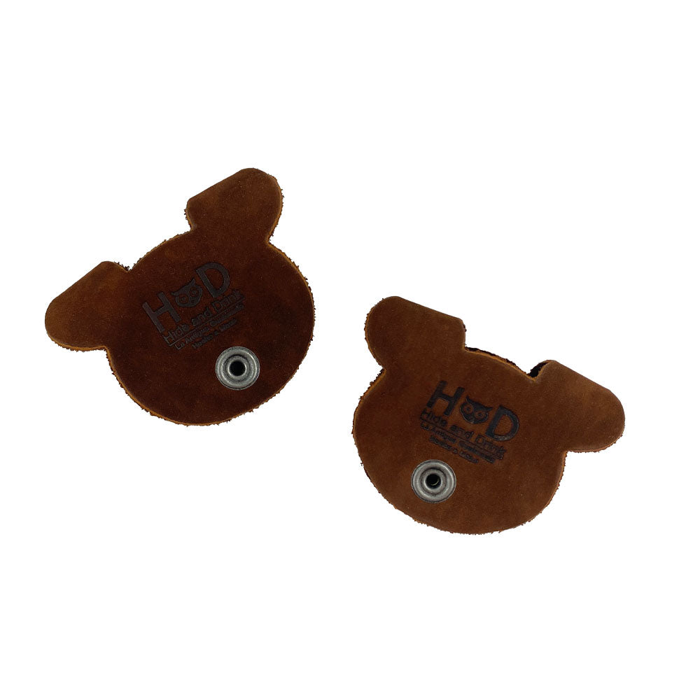 Back view of Bear Shaped Cord Keepers (Cord Clam) by Hide & Drink, showcasing quality Full Grain Leather and fire branded craftsmanship. Artisan made in La Antigua Guatemala & Oaxaca Mexico. Small Batch Production.
