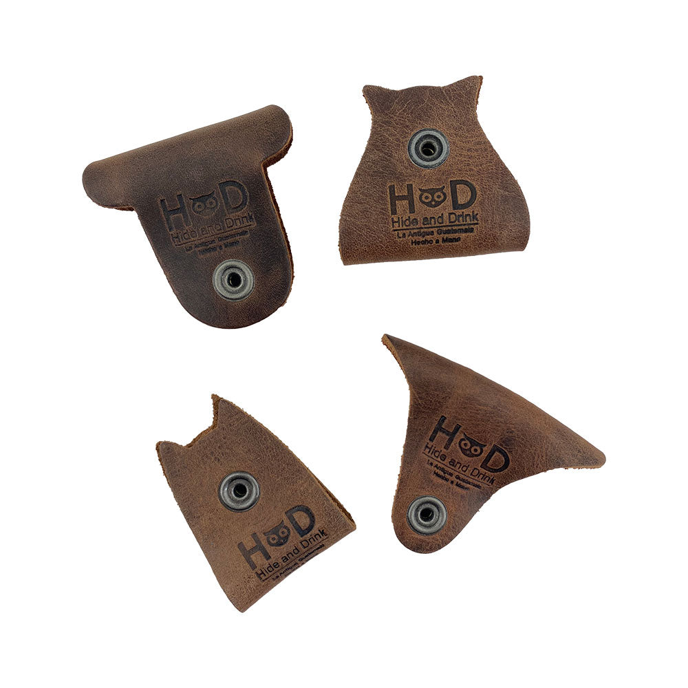 Furry Friends Cord Keeper (4-Pack), showcasing playful animal designs, crafted from full grain leather by Hide & Drink, perfect for cable management. Furry Friends 4-Pack Cord Keeper (Cord Clam), Full Grain Leather, StockyardX, Small Batch Production, Hand Cut, Hand Sewn, Fire Branded, Artisan, Handmade in La Antigua Guatemala & Oaxaca Mexico.