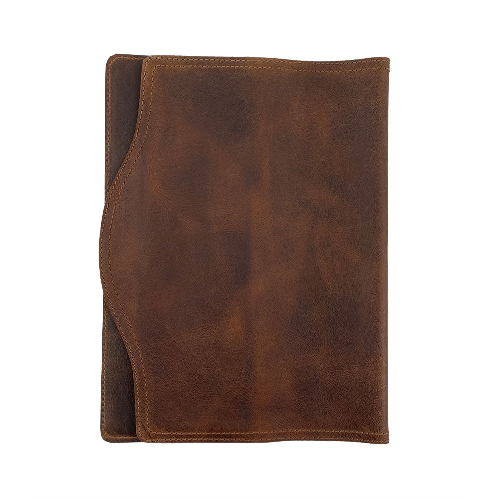 The elegant exterior of the Hard Cover Notebook Protector (Notebook NOT Included) by Hide & Drink, showcasing premium leather craftsmanship. Designed for Moleskine Hard Cover Sketchbook XXL Size (8.5 x 11 in.), Notebook NOT Included, featuring Full Grain Leather, this piece is part of StockyardX’s small batch production with hand cut, hand sewn, and fire branded finishes done by artisans, proudly handmade in La Antigua Guatemala & Oaxaca Mexico.