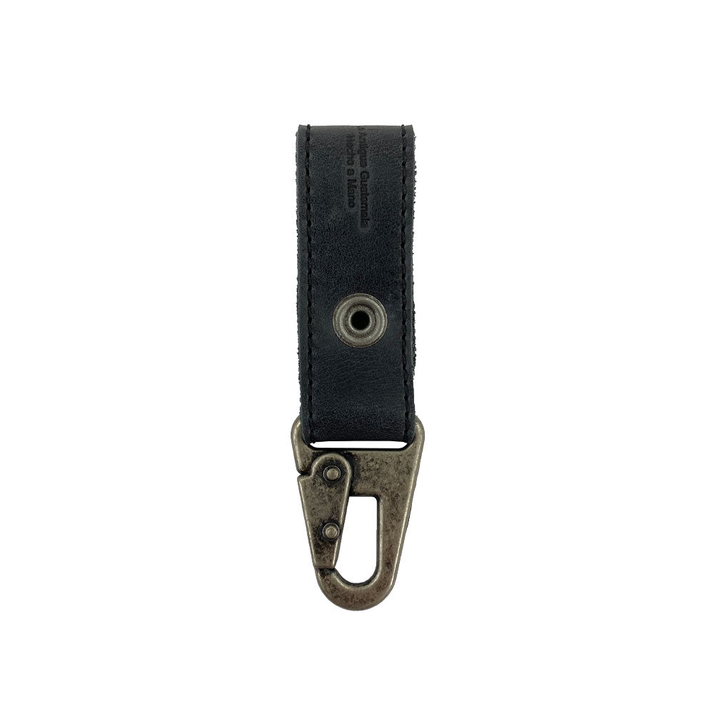 Back view of a black Key Ring Holder by Hide & Drink, demonstrating its sturdy Full Grain Leather design. This handmade item is part of StockyardX's small batch production, featuring hand-cut, hand-sewn details and fire branding, all expertly crafted in La Antigua Guatemala & Oaxaca Mexico.