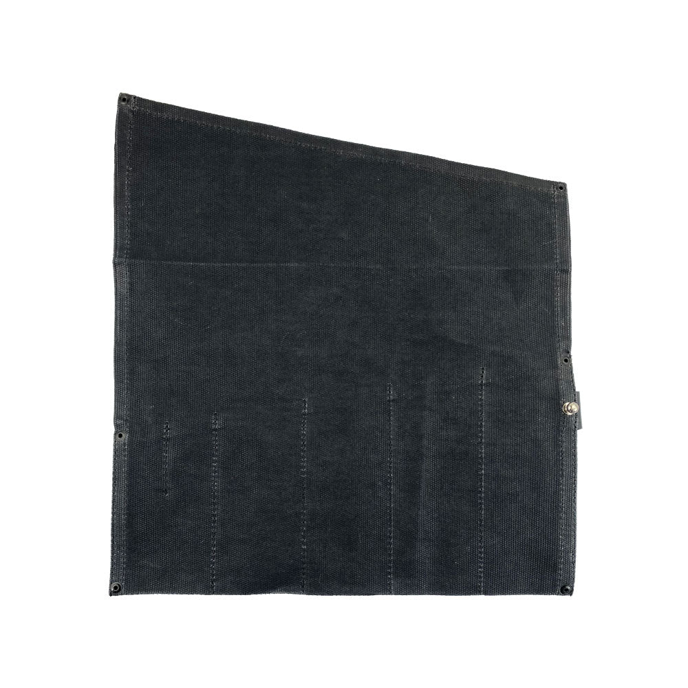 The Large Tool Roll from Hide & Drink shown in an open display, demonstrating functionality. This Portable Carry-On Pouch includes 6 slots tailored for woodworking tools organization. Crafted with waxed canvas and full grain leather variations, this artisan piece showcases the quality of hand cut and hand sewn detailing, handmade in La Antigua Guatemala & Oaxaca Mexico.
