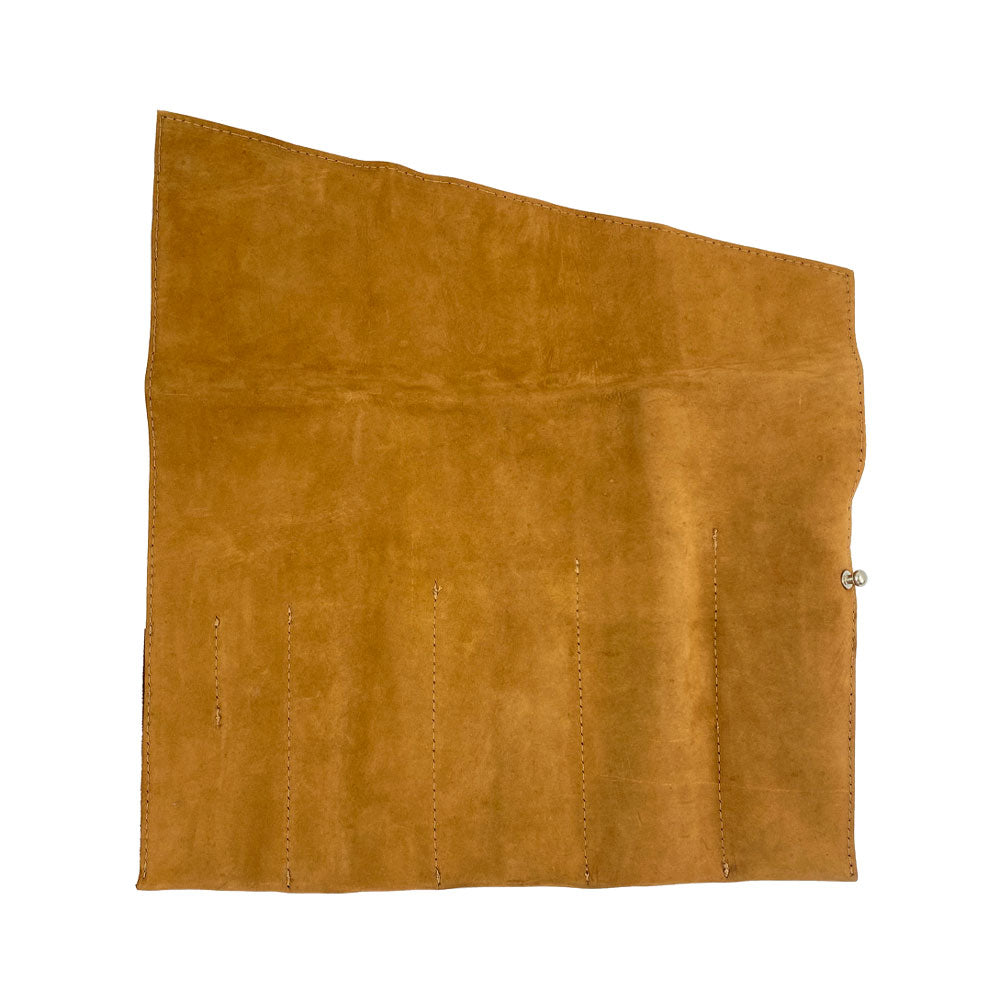A large open view of the Large Tool Roll from Hide & Drink. This Portable Carry-On Pouch offers 6 neatly organized slots for woodworking tools. Crafted using waxed canvas and full grain leather variations, this artisan item showcases meticulous hand-cut, hand-sewn craftsmanship, handmade in La Antigua Guatemala & Oaxaca Mexico.
