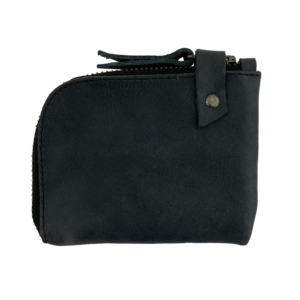 Side view of the black Lion's Mane Zippered Wallet by Hide & Drink, showcasing its elegant finish and artisan craftsmanship. A great choice for anyone in need of a practical cash holder.